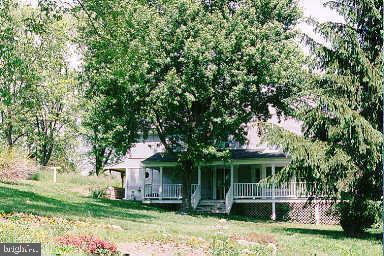 ***FIXER UPPER 
BEING SOLD AS- IS
LARGE RURAL HOME FEATURES POCKET CEILINGS, CHAIR RAILS, MODERN COUNTRY KITCHEN, WRAP AROUND PORCH, 2ND FLOOR DECK, NEW ROOF