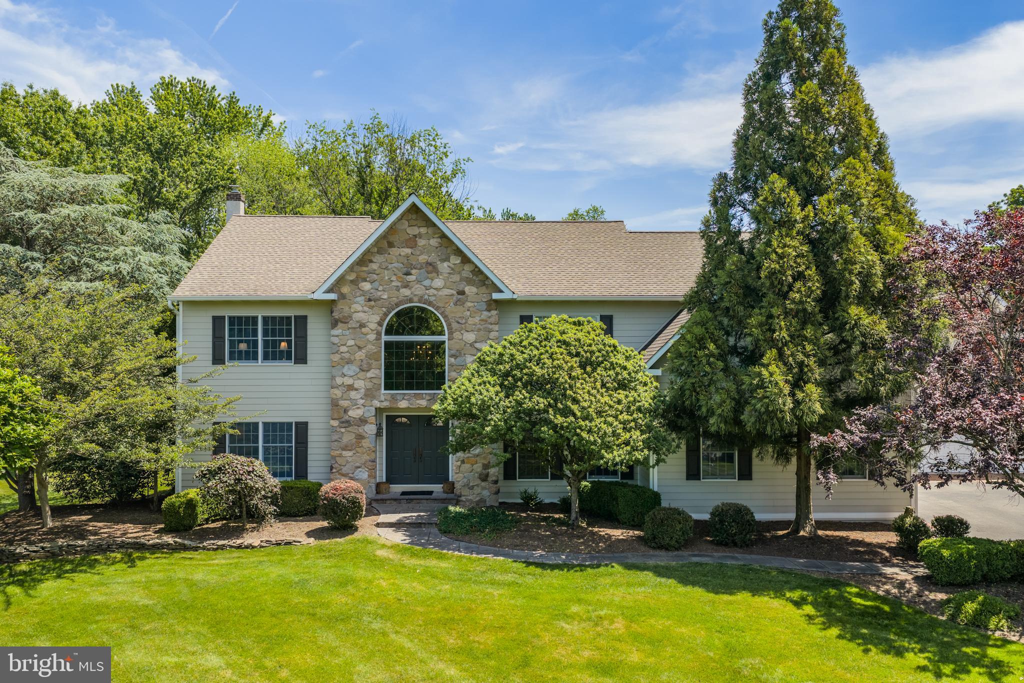 Welcome to 1203 Slough Drive, a beautiful estate home with 4 BRs AND 3½ BATHS ON 2.76 ACRES in Worcester Township / Methacton School District.  This luxury property has been meticulously maintained by the original owners with PREMIUM UPDATES throughout.
Tucked into a private cul-de-sac, the STONE AND CEMENT SIDING exterior overlooks a gently sloping front yard and long driveway.  
The main floor living areas are all HARDWOOD AND FILLED WITH LIGHT.  The spacious foyer is flanked by a comfortable, private office on one side and a large living room on the other, which then opens into the formal dining room.  
The UPDATED CUSTOM KITCHEN features real STONE QUARTZITE counters, INDUCTION COOKTOP, Bosch appliances, coffee bar, and WALK-IN PANTRY.  The kitchen extends to a sun-filled casual dining area leading to the inviting FAMILY ROOM, featuring a TWO-STORY STONE FIREPLACE flanked by large windows, VAULTED CEILING, and back staircase.
A cheerful SUNROOM WITH FRONT ENTRANCE AND REAR PATIO seamlessly connects the main house to the addition – with staircase to a large space ready to be finished as an office, living area, au-pair or in-law suite – PREPPED FOR HEAT, AC, and ROUGHED FOR PLUMBING.
Completing the main floor is an EXPANSIVE LAUNDRY ROOM with a wall of CUSTOM CLOSET-LOCKERS for each family member to stay organized! 
The second floor features an UPDATED PRIMARY SUITE with tray ceiling, hardwood floor, cozy private reading nook, 2 CUSTOM WALK-IN CLOSETS, and UPDATED PRIMARY BATH.  Three spacious bedrooms and an UPDATED HALL BATH complete the second floor.
The basement includes a large FINISHED LIVING AREA with kitchenette and FULL BATH, plenty of STORAGE, workshop, and exterior access.  
The property offers beautiful outdoor space.  There’s a STONE PATIO accessible from the kitchen and family room; a path leading to a completely FENCED, PRIVATE POOL oasis; and an EXPANSIVE YARD for games, sports, and relaxation.
This welcoming estate is ready for its next owners.  Luxury living with a rural setting; close proximity to Lansdale, Ambler, Collegeville; easy access to major routes and Philadelphia.  You really have to see it – make an appointment today!