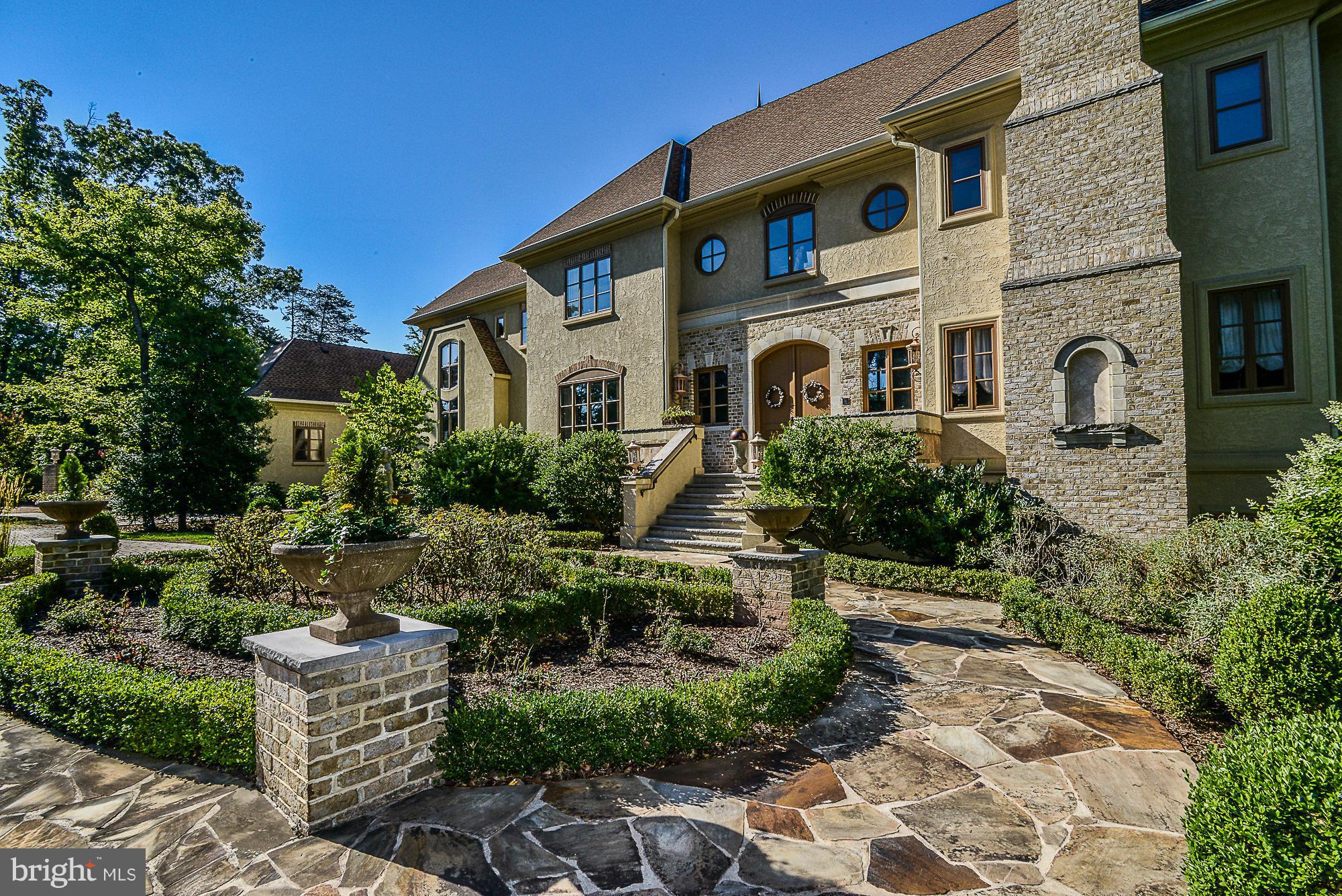 Langley School tier! Why wait for new construction? Move right in & enjoy this barely lived in 13,000+ fin. sq.ft home, selected as Habersham Furniture showcase home & built by Award Winning Chesapeake Construction Co. Every room exudes luxury and quality! Grand entry  breath taking views of 2 acre pond  main level & upper level master suites au pair suite  chef's kit multiple entertaining areas