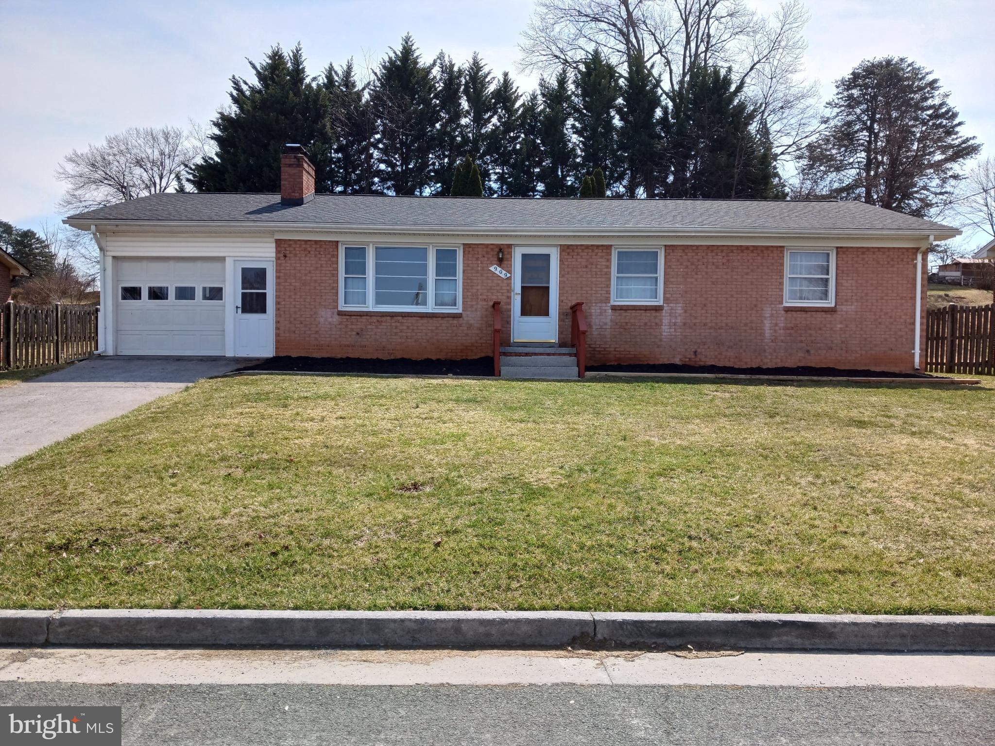 This all-brick ranch home is a perfect blend of charm and functionality. The location is ideal, just a block away from the elementary school, making it a great option for families. This property sits approximately 1 mile from the downtown area of Front Royal, convenient to fuel stations, banks, shopping, dining, and much more. Local attractions such as Skyline Dr, Shenandoah Caverns, Luray Caverns, kayaking, tubing & fishing on the Shenandoah river. The main level of the home boasts beautiful hardwood floors, a brick fireplace, and sconce lighting, creating a warm and inviting atmosphere. With 3 bedrooms and 2.5 baths, there is ample space for a growing family. The kitchen is equipped with a pantry, and the dining room features French doors that lead out to a spacious deck and serene backyard, perfect for spending time outdoors. The finished basement is a fantastic bonus, offering a kitchenette, bedroom, family room, sitting room, full bath, and a cozy stone fireplace. This space can serve as an in-law suite, guest quarters, or home office. The home's exterior features are impressive, with a large front and backyard that includes a stone wall, shed, and specious 20x30 covered patio. The single-car garage with a storage room provides a dedicated space for parking and area for maximizing space, ideal for homeowners who enjoy hobbies, gardening, or other activities that require additional equipment and supplies. No HOA.  Don't miss out on this wonderful opportunity to call home! Motivated seller! 25K price drop. $10K in closing cost assistance from the seller. Home warranty included!