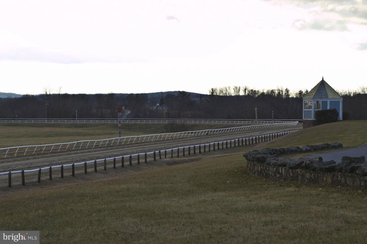 Priced to sell! The legendary Paul Mellon built the Middleburg Training center in 1956 and it has been an epicenter for race horse training ever since. The property includes 11 barns, 220 stalls, 22 paddocks, 3 wells, a pond and a beautiful 7/8th mile track. Lots of tack rooms, groom apartments, offices, machine shop and a 2 br tenant house. Significant tax credit or development potential.