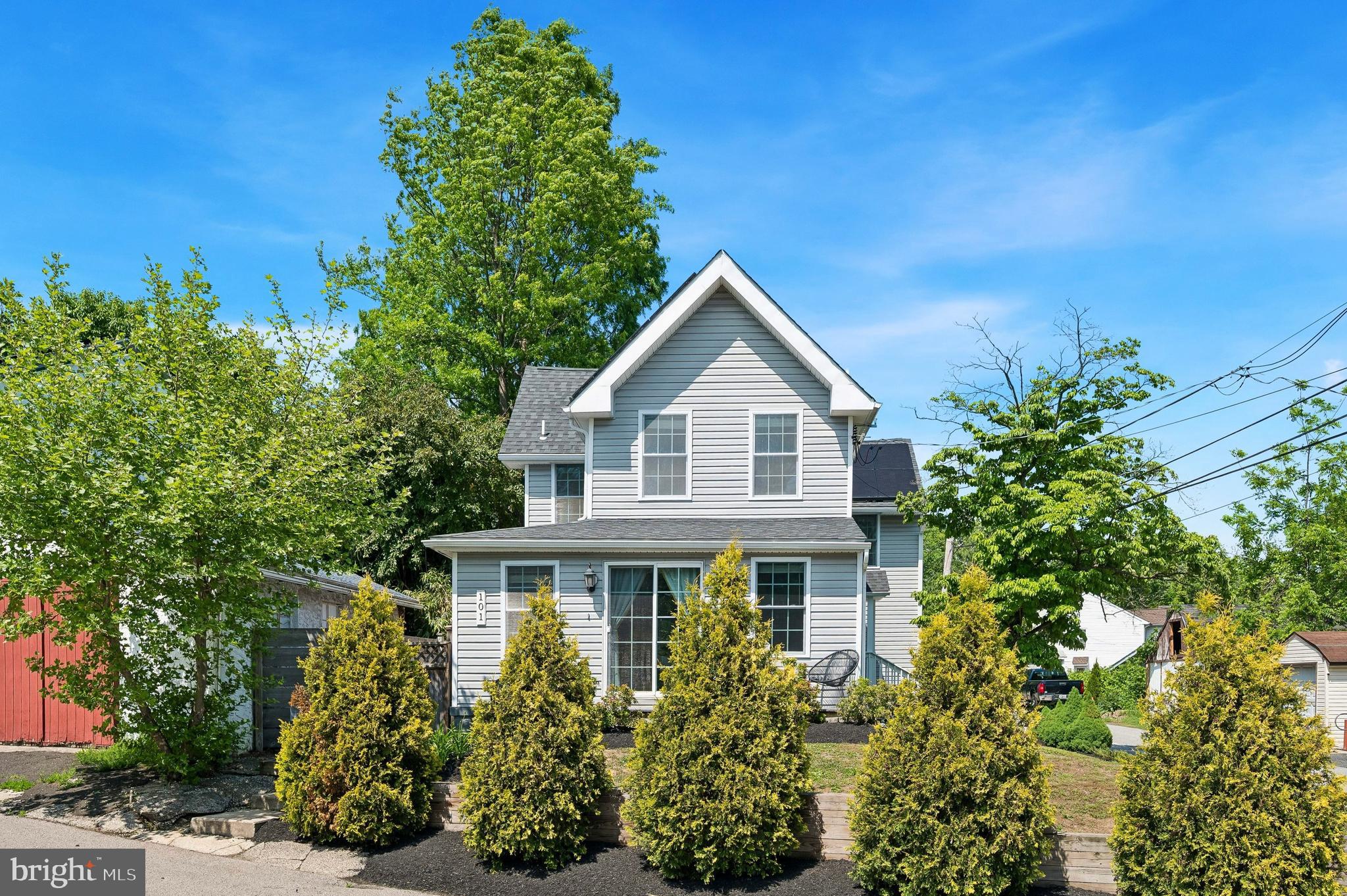 You'll love this beautifully updated single family home in the heart of Media that offers 3/4 bedrooms, 3 full baths and has been beautifully renovated from top to bottom. The flexible main-level layout offers an excellent in-law or en suite potential, as the family room can easily be converted into a fourth bedroom with direct access to the full bath — ideal for guests, multigenerational living, or senior parents.  The heart of the home is the beautifully designed kitchen featuring custom cabinetry, white quartz countertops, stainless steel appliances, pendant lighting, and an inviting open-concept layout. Sliding glass doors lead to a private rear deck, creating the perfect setting for entertaining, outdoor dining, and summer BBQs. Adjacent to the kitchen is the informal dining area highlighted by a cozy gas fireplace, seamlessly flowing into the spacious family room with dedicated office space, access to a second deck, and a full bath. Upstairs, you’ll find three additional bedrooms and two full baths, including a spectacular primary suite featuring vaulted ceilings, a gas fireplace, a walk-in closet, and a bonus flex space perfect for a second home office, sitting area, or workout nook. The luxurious primary bath includes a double bowl vanity, soaking tub, and expanded stall shower. Two additional bedrooms share a convenient Jack-and-Jill bath. And a second-floor laundry area with stacked washer and dryer adds everyday convenience. Additional highlights include a two-car attached garage and driveway parking, solar panels reducing monthly carrying costs, wood plank accent walls and ceilings, barn doors, a second laundry hookup on the main level, a newer roof, newer siding and newer HVAC.  This home offers the perfect blend of style, flexibility, and efficiency.  All of this is located within the award-winning Wallingford-Swarthmore School District and just steps from the incredible shopping, dining, and nightlife that downtown Media is known for — including the beloved "Dining Under the Stars" during the warmer months.