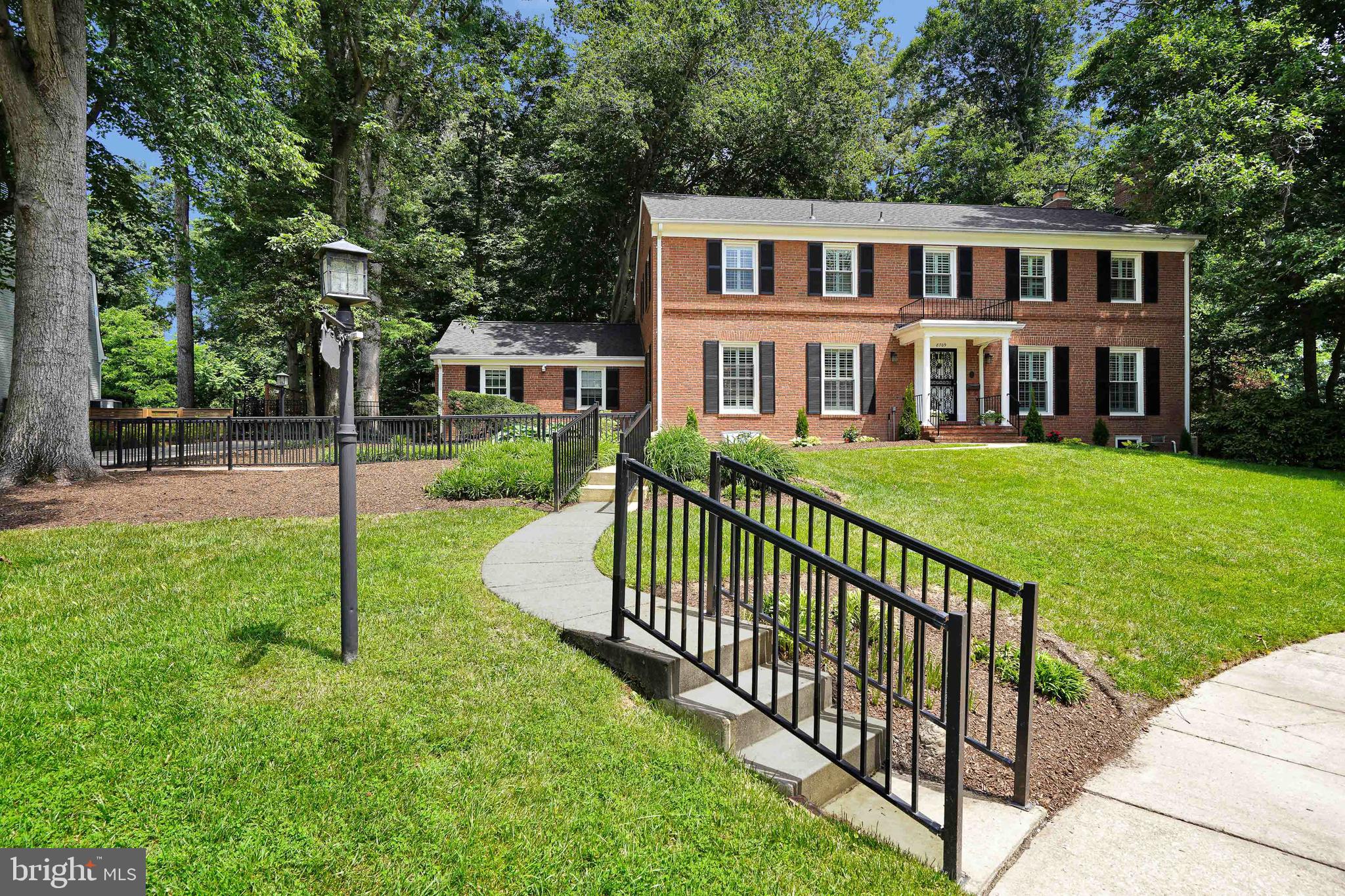 This is the home that you have been waiting for! This immaculate and "move in ready" home boasts a winter view of the Potomac River and backs to the bike trail leading from D.C. to Mount Vernon.  Elegant and stately this residence is located on a beautiful cul-de-sac in the desirable Waynewood neighborhood and is situated on just under 1/2 acre of very private wooded land which extends approximately 10 feet beyond the back aluminum fence. The home sits on land which was a part of the Five Farms of Mount Vernon owned by George Washington.  Note.... Waynewood Elementary School District!!  This beautiful home has many recent updates including a gorgeous brand- new kitchen featuring  designer selected white cabinetry, handsome quartz countertops, a subway tile backsplash, pristine LG appliances, gas cooking, both a central work island and a dedicated space for a breakfast area adjacent to the large bay window with a view of the serene wooded back yard. A large laundry room is off of the kitchen and there is easy access to the 2-car garage for convenience.  Handsome hardwood floors have just been refinished and the entire house has been freshly painted with neutral designer tones. New lighting features have been added in the dining room, entrance foyer and hallways. LED recessed lighting and dimmers have also been added in the kitchen and family room. On each side of the entrance foyer French doors welcome you to both the inviting living room with fireplace and the elegant dining room with built in cabinetry.  Plantation shutters are on all windows on the front and most side windows of the house. Bathrooms have been updated and freshened. Across from the kitchen is the welcoming bright family room with built-ins, brick front fireplace, and large windows overlooking the serene wooded fenced backyard. You will love the screened porch to be enjoyed on warm summer evenings that can be accessed from the family room or the back yard.  All 5 upstairs bedrooms feature hardwood floors, ceiling fans, and newly installed recessed LED lighting fixtures and dimmers. The spacious primary bedroom includes a separate closet area and elegant ensuite with both a jetted soaking tub and a separate marble shower. 3 full bathrooms are conveniently located on the bedroom level. What a surprise you will find in bedroom #3 where you can walk out to a roof top deck overlooking the wooded backyard. Bedrooms #4 & #5 have a Jack and Jill bathroom with a new luxury shower tower. Storage is abundant in the extremely large, floored attic with very high ceiling which can be easily accessed by a permanent staircase off the bedroom level hallway. More surprises on the lower level where an enormous walk-out basement rec room with windows has been newly renovated featuring a 3rd fireplace, new luxury vinyl flooring, newly updated powder room and another large storage area. This provides enough space for a workout area or 6th bedroom! A perfect home for entertaining, the exceptionally private and spacious backyard has a picturesque brick patio area perfect for quiet evenings with the family or larger gatherings with friends.   Additionally, there is a front yard sprinkler system, a house emergency generator, the ability to convert the wood fireplaces to gas, double car garage with automatic door opener and a concrete driveway that will accommodate 3 to 4 cars. The exterior of the house has been freshly painted and new exterior window shutters have been added. If desired this home has a Waynewood Pool Membership that conveys for $1.00 by separate bill of sale!! Just in time for a hot Washington summer! This conveniently located residence is between Old Town Alexandria and Mount Vernon. Fort Belvoir is an easy commute as is Reagan National Airport, the Pentagon, Amazon HQ2, and Washington DC.  The bike Trail is very close by as is Fort Hunt Park.