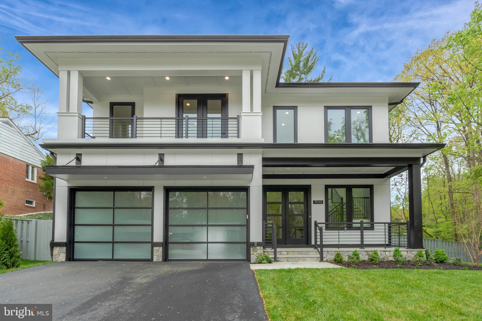 Discover this  gem in Annandale, Virginia, just minutes from the Beltway and Tyson's Corner and DC. Upon entry through a grand, double-height foyer, you are immediately captivated by the elegant design of this home. To the left, an executive office features sleek, full glass walls and doors, offering both privacy and light. To the right, you'll find a powder room, coat closet,  and access to the oversized garage with epoxy floors and modern translucent doors.
Proceed down the hall on the white oak floors that run throughout the house to the family room with a beautifully tiled gas fireplace on the left, and a chef's kitchen adorned with stunning quartz countertops on the right. The kitchen in this Falls Church home is a chef's dream, equipped with high-end GE Cafe appliances. The six-burner range, complete with a griddle, offers unparalleled cooking versatility for various gatherings. The kitchen features a sleek and spacious built-in refrigerator/freezer for ample storage. The super quiet dishwasher ensures a peaceful environment during post-meal cleanup.  A convenient wall oven is perfect for roasting and baking, with a microwave above for quick meal prep. Integrated appliances maintain a seamless kitchen flow, complemented by striking quartz countertops for elegance and durability. Abundant custom cabinetry provides organization, making it the ultimate space for culinary creativity and casual dining. Experience seamless indoor-outdoor living through a 15-foot sliding door that opens to a covered porch with privacy wall, along with an attached deck. The deck is outfitted with a complete outdoor kitchen, perfect for al fresco cooking and dining.

The main floor also includes a breakfast area and a delightful morning room. Upstairs, discover three spacious bedrooms and a convenient laundry room with ample cabinetry. The primary bedroom offers a cozy sitting area with a fireplace,  a luxurious spa-like bathroom featuring a French-styled bath, heated floors, two toilets, dual vanities, and two walk-in closets—one with an island. Additionally, there’s another bedroom with a balcony and en suite bathroom, along with a generously sized princess suite, also with its own en suite bathroom.

On the top level, find a loft office with a wet bar, an additional bedroom, and a full hall bath. 
Outside in your privacy fence enclosed garden, enjoy a lush, locally sourced improved tall fescue lawn—the ideal turfgrass for Northern Virginia—along with expertly designed landscaping that provides privacy, featuring green giant arborvitaes curated by a professional designer. The carefully selected plants are built to thrive for decades, all complemented by a state-of-the-art in-group Fabulous primary suite with luxury bathroom that has  heated floors and 2 oversized walk in closets.  Introducing a  stunning new home by Premier Homes Group LLC, nestled on a serene cul-de-sac overlooking lush wooded parkland. Seamlessly blending tranquility with convenience, this exquisite residence offers unparalleled access to major landmarks and amenities. Situated mere moments from the capital beltway, Fairfax Hospital, the vibrant Mosaic District, Tysons Corner, picturesque parks, the Pentagon, and the cultural heartbeat of Washington, D.C., this is the epitome of modern living!