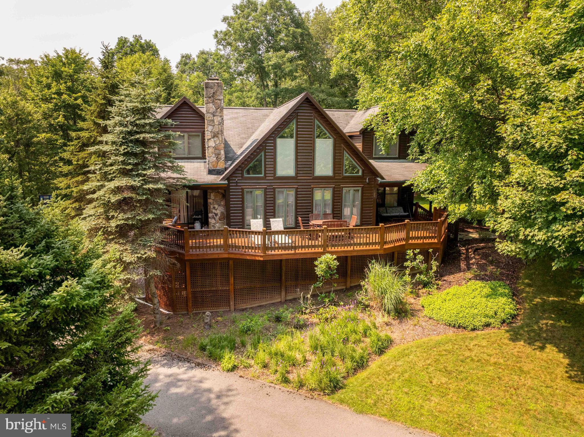 LAKEFRONT 4BR, 3.5BA log home with over 3300sf and 4.35 acres of privacy! Lovingly maintained property with gorgeous views of the  10 acre lake from almost every room in the house! Peaceful surroundings with towering mature trees and just enough yard space in a very laid back, rural setting near Herrington Manor and Swallow Falls state parks. If that weren't impressive enough, Meadow Lake Estates community is adjacent to 598 acres of DNR / state land fronting on the Youghiogheny River. Set up for one level living - bedroom suite and laundry room on first floor. Features include whole-house generator, wood-burning fireplace, a recently finished basement adding a game room and a fourth bedroom, front and rear decks (trex on back deck), covered porches, fire-pit, wrap-around driveway and a spacious loft that serves as a third living room. Must see to appreciate the solitude of this fantastic home! Furnishings negotiable.