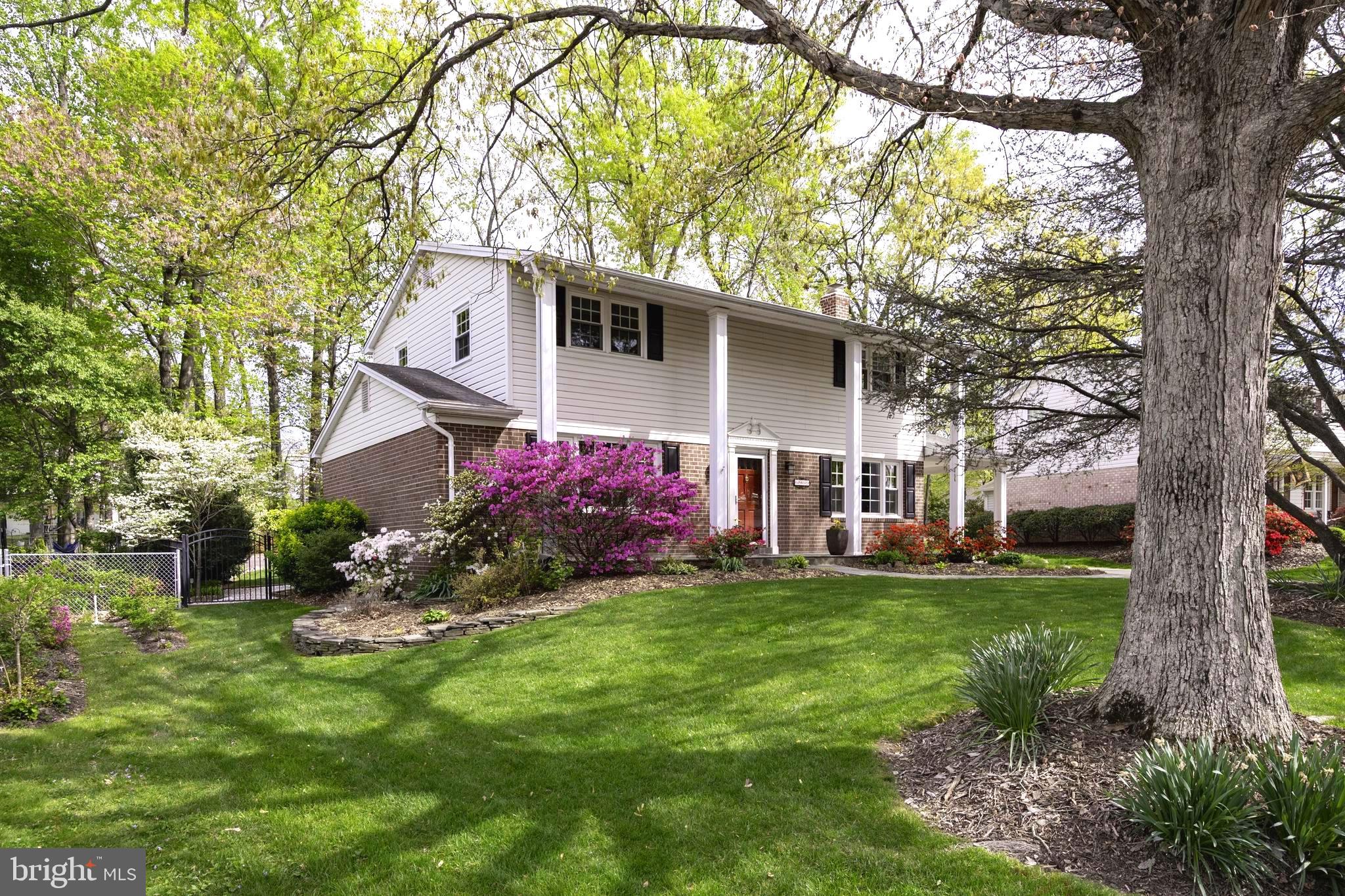 Nestled in the Orange Hunt Estates neighborhood, this impeccably maintained New Master Colonial Model features an array of upgrades that cater to the most discerning homeowner. The home welcomes you with its classic columned and flagstone front porch and charms you with its blend of traditional elegance with modern sophistication.  Every detail has been thoughtfully updated to enhance both form and function. The spacious layout is perfect for modern living, providing ample room for relaxation and entertainment. 

The Main Level includes an open layout to all rooms with expanded openings (for maximizing flow) and hardwood oak flooring in all living spaces, plus a tiled powder room/half bath. The kitchen features catering-level appliances including a Thermador double wall electric ovens with convection and rotisserie features, a 5-burner Viking gas cooktop range, a GE Monogram outdoor-exhausting filtered hood with warming racks, an oversized KitchenAid barn door refrigerator with lower door freezer/icemaker, and a deep, double-sized undermount stainless steel sink with Grohe faucet. The expansive counters are sealed Icestone, made in the USA from eco-friendly recycled concrete with embedded glass and seashells for texture and accents. Full floor-to-ceiling KraftMaid hardwood maple cabinetry with contemporary European door-pulls covers all functional areas of the kitchen for maximum storage space. The kitchen includes a closet pantry, extensive overhead lighting with dimming feature, under-counter lighting, and a multi-seat counter bar that seamlessly transitions into the adjoining family room with matching KraftMaid built-in bookshelves, cabinets, and a work desk with Icestone worktop. The spacious family room includes space for combined seating or casual eat-in area, a gas fireplace with custom European tile accents, a separate carport entry side door, and full glass double French doors to access a large multi-season sunroom addition. The current owners have switched the traditional formal living room with the dining room to make the dining area larger for entertaining purposes. This ingenious alteration allows for more space to host large gatherings while maintaining the home's classic charm.

Outdoor entertaining, cooking, and dining is just as effortless on the massive deck (connected to the living room via a sliding glass door), an ideal spot for hosting gatherings with friends and family. The  400ft deck is made of highest-quality EverGrain composite decking material for a long deck life, easy cleaning, and comfort and includes a LED-based deck lighting system.  The deck seamlessly transitions into the  250ft  sunroom addition, where you can soak in the serene backyard views through the changing seasons. Whether you're basking in the summer sun or cozying up during a winter snowfall, this sunroom provides a tranquil retreat and includes stained wood paneling and ceilings, lower screened windows, a side door with step-free access to the carport, and its own heating/air conditioning system. Step outside to discover a spectacular backyard oasis, meticulously designed with luscious landscaping that blooms in vibrant colors annually that combines flower beds, a grass lawn space, vegetable garden boxes, a forested mature tree space with flagstones for a firepit and hammock as well as gravel pathways with full outdoor lighting coverage. A single-space carport connects to the family room and the backyard with a storage shed and flagstone accents and walkways. A second backyard shed offers additional storage space, ensuring that every inch of this property is utilized to its fullest potential. Additional property features include a fully enclosed backyard of high-quality aluminum fencing with gates, tiered side flower gardens of dry stack stone wall landscaping, a paved concrete driveway, and a uniquely recognizable mature Atlas Cedar evergreen tree in the front yard.

NO HOA