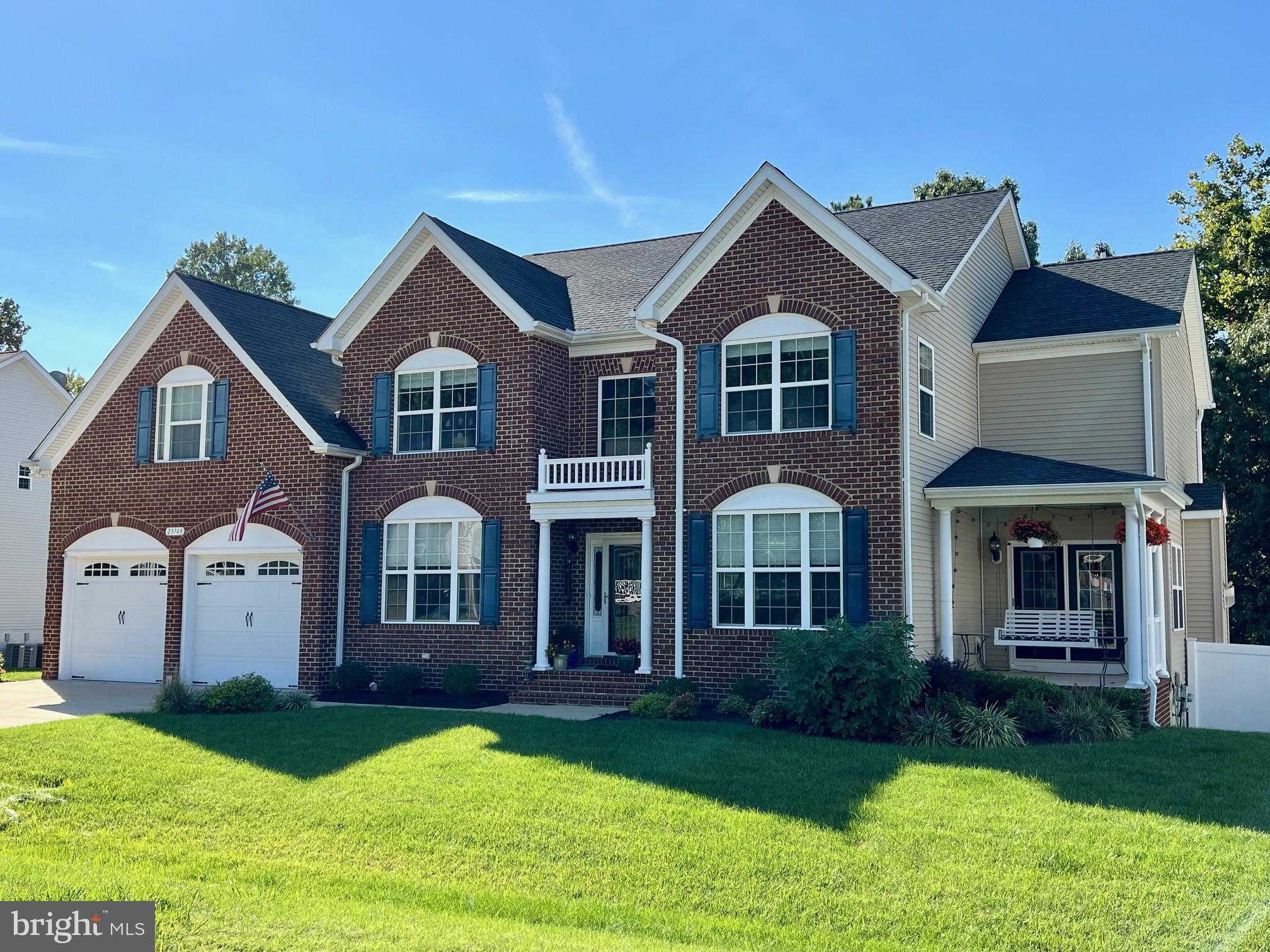 This exceptional home is designed with luxury and space in mind, featuring expansive rooms thanks to bump-outs on two sides. The main level is an entertainer's dream, boasting an open floor plan that seamlessly connects the gourmet kitchen, breakfast room, family room, dining area, and sunroom. A library or office adds a touch of versatility. Hardwood floors run throughout the first two levels, adding elegance to every room.

The walkout basement provides an additional living space ideal for guests or teenagers, complete with a theater room, bedroom, full bath, game room, wet bar, and a gym outfitted with rubber flooring and mirrors. The oversized  40 x 20  garage comfortably fits two  vehicles, with extra large storage space. 

The sunroom opens to an upper deck with stairs leading down to a custom patio, perfect for outdoor entertaining. The home is packed with premium features, including custom blinds, a fire pit, generator hookup, a spot for an outdoor movie screen,  built in safe, tiled backsplash, and a privacy fence. Situated on a premium lot with a brick front, this home exudes curb appeal & pride of ownership.
