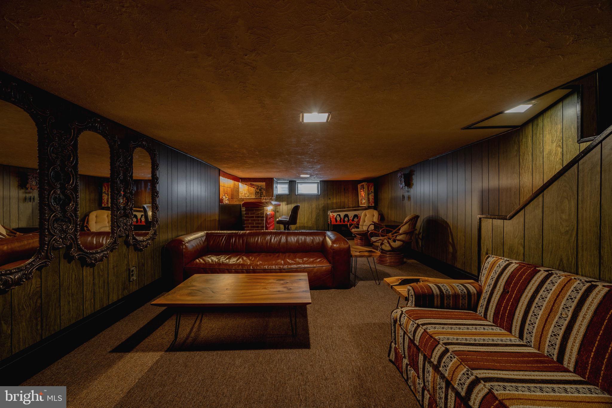 With its freshly pointed brick façade and oversized bay window, 1030 Wolf Street has undeniable curb appeal, but it’s the pride of ownership on the inside that truly sets it apart. Enter through an absolute vibe of a vestibule adorned with original parquet flooring, curated wallpaper, and a colored glass time capsule door.

What catches your eye first? Is it the refinished original inlayed hardwood floors? The generous width of the interior? Or is it the overall vibe?

Furnishing this home is going to be fun—it’s hard not to start planning already. You can finally get that sectional you’ve always wanted, and it’s confirmed, the dining table can be deep enough to comfortably host all your loved ones. That’s not all, the kitchen is spacious enough for seating, too! And with warm weather quickly approaching, the well-kept backyard provides the seamless option for dining al fresco like a true South Philadelphian.

Venture upstairs to the second floor and notice the continuation of those original hardwoods. Each of the bedrooms are thoughtfully modernized; anchored by charming baseboard trim and five-panel entry doors with matte black hardware. The rear bedroom has a large cedar closet with mirrored doors and ample storage space, too!

The full bath features a mid-century medicine cabinet with side lighting, a vanity with ample counter space, and matte black fixtures. An exclusive linen closet provides efficiency, while the brand new mosaic tile floors give the perfect blend of updated and familiar.

Head to the lower level and experience what sets the tone at 1030 Wolf Street. Wrapped in moody wood paneling, this finished basement is a true retreat! A faux fireplace cues up the lounge area, while the primo seating is located at the illuminated wet bar. A quaint powder room and proper utility space with an OG wine press and laundry hookups are also located in the basement. 

We welcome your visit!