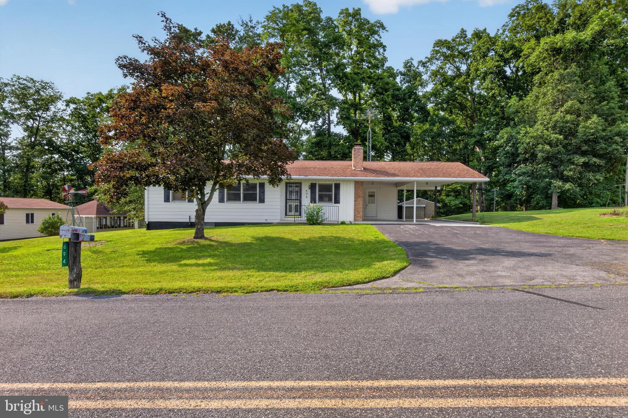 This charming 3-bedroom, 1.5-bath home offers solid bones and endless potential. Situated on a spacious 0.81-acre lot, the property provides the perfect blend of country living with scenic views and a backyard that borders a private wooded area. Features include an attached (2) covered carport and a separate detached covered carport, which could easily be modified into a closed one-car garage.  Cozy brick wood fireplace in the dining area, central air, full basement for storage plus beautiful rural setting!

Please note the following details regarding the sale:

  - The property is being sold "as is." While it could benefit from updating and TLC, the water pump and water tank were recently replaced in September 2025.
  - The seller will make no repairs. Inspections are welcome for the buyer's information purposes only.

Don't miss out on this amazing opportunity -  schedule your private tour today.