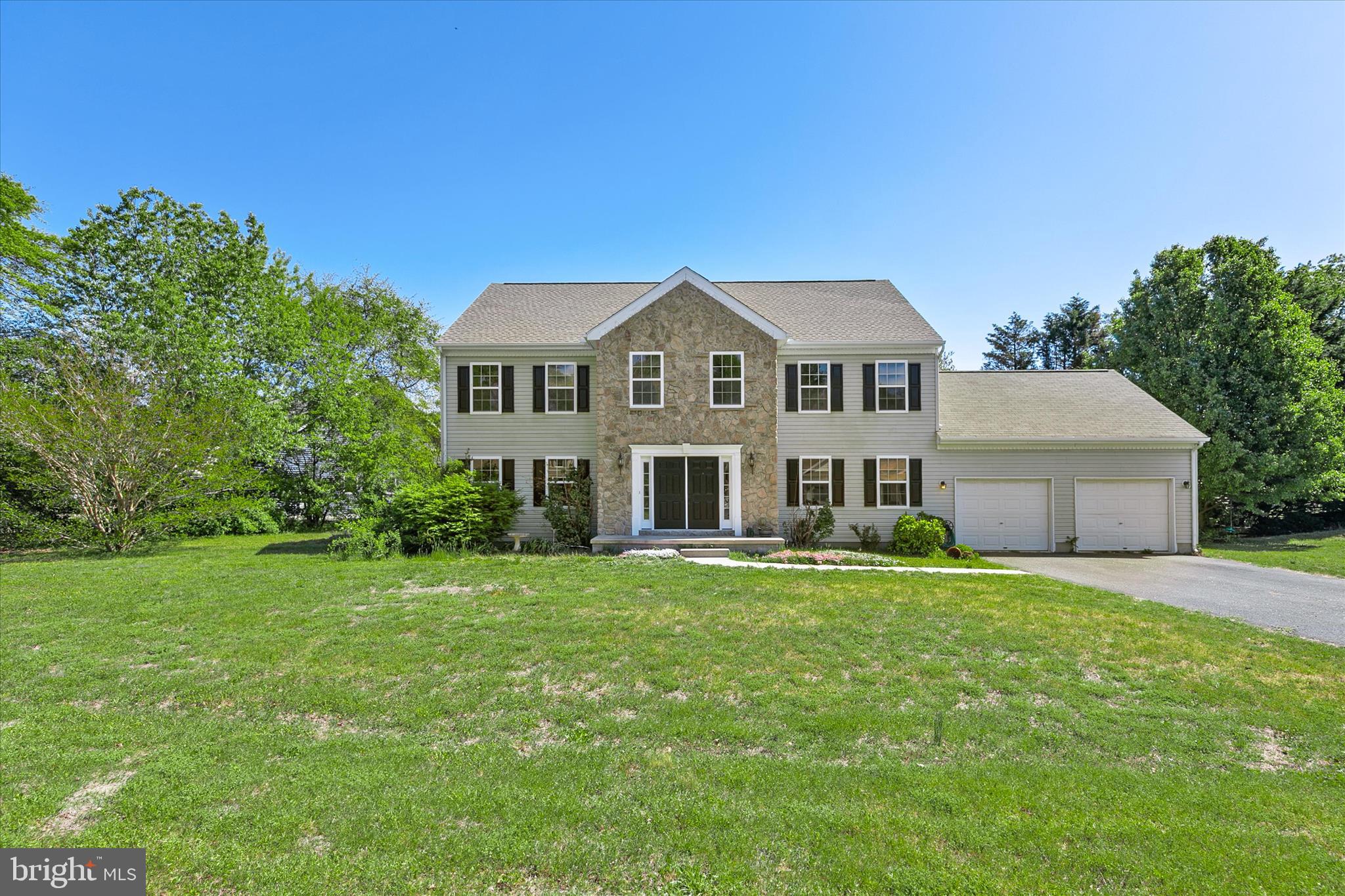 Welcome to 305 Baywinds Court, a classic colonial nestled on an expansive 0.91-acre homesite in the established waterfront community of Seawinds. Thoughtfully refreshed with fresh paint throughout, new luxury vinyl plank flooring on the main level, and plush new carpeting upstairs, this home offers a wonderful foundation for comfortable living with the opportunity to add your own personal touches over time. A welcoming foyer sets the tone, showcasing the home’s bright, open feel throughout the main level. To either side, formal living and dining rooms create inviting spaces for both everyday living and special gatherings. At the heart of the home, the spacious eat-in kitchen is designed for functionality and connection, offering abundant cabinetry, generous prep space, a center island with breakfast bar, and a casual dining area. With direct access to the deck, indoor-outdoor entertaining comes naturally, perfect for enjoying quiet mornings or hosting friends and family. Just off the kitchen, the family room provides a relaxed setting to unwind at the end of the day. A powder room, laundry area, and interior access to the two-car garage complete the main level. Upstairs, new carpeting adds warmth and continuity throughout. The primary suite serves as a private retreat, featuring a spacious ensuite bath with dual vanities, a soaking tub, separate shower, and private water closet. Three additional bedrooms and a full hall bath offer comfortable accommodations for family or guests. Located in the peaceful, water-privileged community of Seawinds, residents enjoy access to a private pier ideal for crabbing, fishing, kayaking, paddleboarding, or simply soaking in the natural surroundings. Just moments from Cripple Creek Golf and Country Club and Holts Landing State Park, and a short drive to area beaches, shopping, and dining, this home combines value, space, and lifestyle in one inviting package.