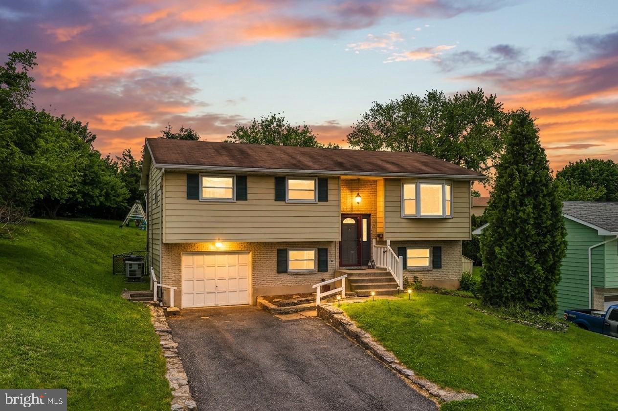 Move right into this spacious split-level home offering four bedrooms, multiple living areas, and updates throughout. Whether you need room for a growing family, guests, a home office, or multi-generational living, this flexible floor plan offers space to fit your lifestyle. The main level is filled with natural light and features a bright family room with a large bay window. Upstairs, you'll find three bedrooms and a full bath, while the lower level offers a fourth bedroom, half bath, and an additional living space perfect for a family room, playroom, media room, home office, or gym. A coal stove provides a supplemental heat source during the colder months. Recent improvements include fresh paint throughout, updated lighting, painted cabinetry and interior doors, newer carpeting upstairs, brand-new carpeting on the stairs and lower level, a newer HVAC system, updated water softener, and a new sliding glass door. Hardwood floors remain beneath the first-floor carpeting, offering future possibilities for the next owner. Step outside to a spacious backyard designed for both play and entertaining, complete with mature trees, an above-ground pool, play set, climbing dome, storage shed, and plenty of open space to enjoy every season. Additional features include a one-car garage, off-street parking, and a built-in security system. Ask how to receive up to $5,000 in lender credit toward closing costs or lowering your interest rate.