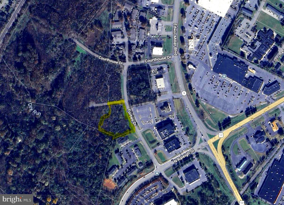 Looking for a  commercial opportunity in the fast-growing, high-density, north end of Martinsburg, but can't stomach the prices of the other options? This 1.8 acre property (Tract A), zoned Mixed-Use Commercial (MUC), offers the possibility to get into this space for around half the price of many of the other currently available options. Permitted uses include general retail, convenience stores, food & beverage, group residential housing, hotels, government facilities, multi-family dwellings, schools, AND MANY OTHERS - see View Docs for the Zoning Ordinance. This property fronts over 300' on Forbes Dr (paved) and backs DIRECTLY up to DRB Homes' 170+/- townhome community known as The Villages at Courthouse Square. Access to this property from Edwin MIller Boulevard would be via the Edwin Miller Blvd and Raleigh St extension intersection (which already has a stoplight) or the Edwin Miller Blvd and Courthouse Dr intersection (which is soon getting a stoplight). An adjacent tract (1.3 Acre Tract B), which also fronts 300'+ on Forbes Dr, and also backs DIRECTLY up to DRB Homes' townhome community, is also available for purchase for $350,000.