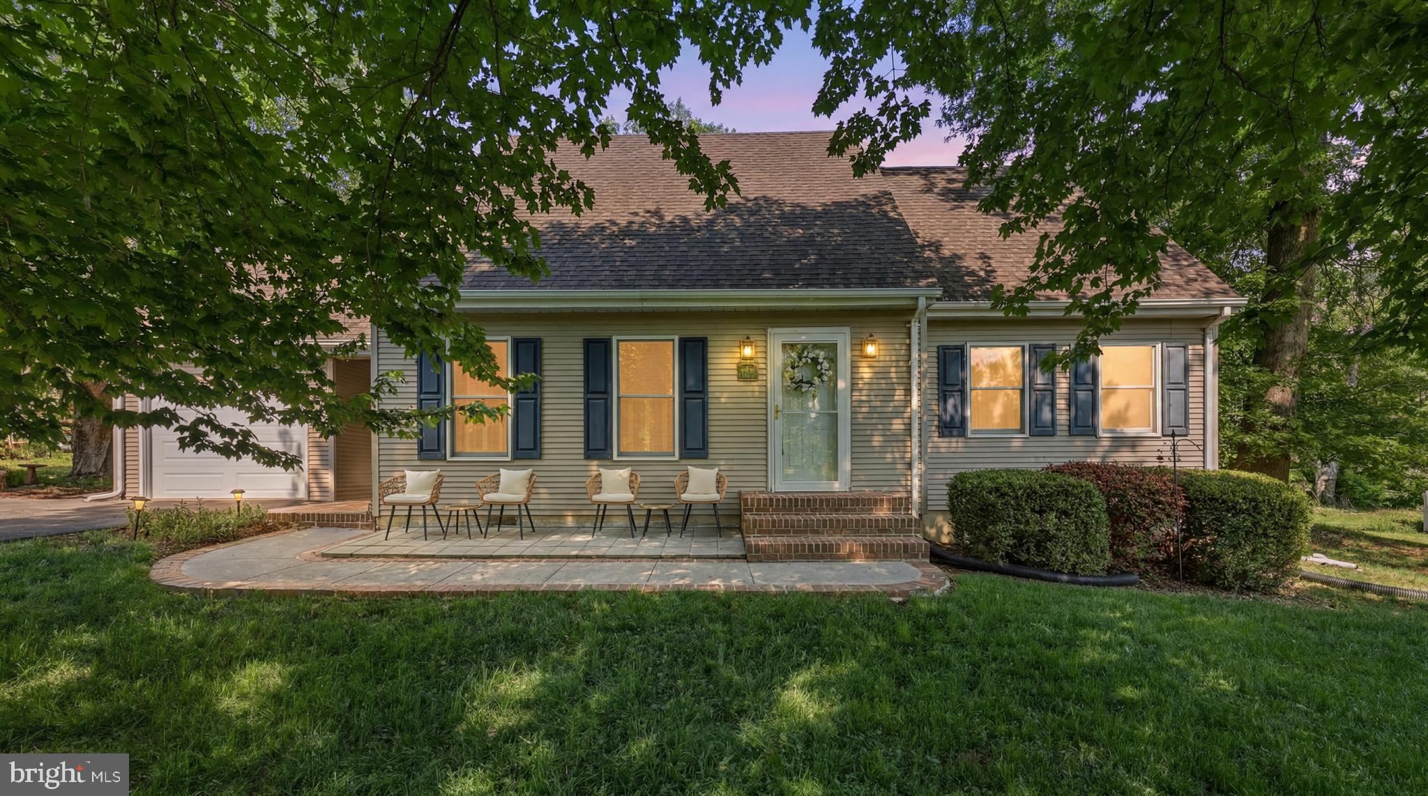 Imagine living just a short walk from everything that makes Shepherdstown special. Located on a beautifully manicured ½-acre lot, 112 Valley Court offers the rare opportunity to enjoy the convenience of walkable living while still having the space and privacy of a well-appointed home. Stroll into historic downtown for dinner, coffee, shopping, weekend farmers markets, university events, or an evening walk — all without getting in your car.

Designed with convenience in mind, the home features a main-level primary bedroom, ideal for buyers seeking accessibility and everyday ease. Upstairs, you’ll find three additional bedrooms and a full bath, providing flexibility for guests, family, work-from-home space, or hobbies. The sleek, updated kitchen serves as the heart of the home and is enhanced by modern amenities including an induction cooktop and a premium Fisher & Paykel drawer dishwasher, blending style, efficiency, and functionality for everyday living and entertaining.

Thoughtful upgrades continue throughout the property, including a Level 2 EV charging plug for electric vehicle owners. Outside, the beautifully landscaped yard offers space to unwind, garden, or host gatherings on the expansive half-acre lot. A spacious Trex deck creates the perfect outdoor living area for relaxing, dining al fresco, or entertaining friends and family.

Whether you're looking for small-town charm, modern conveniences, or room to grow, this home delivers the lifestyle buyers are searching for in one of Shepherdstown’s most sought-after locations.