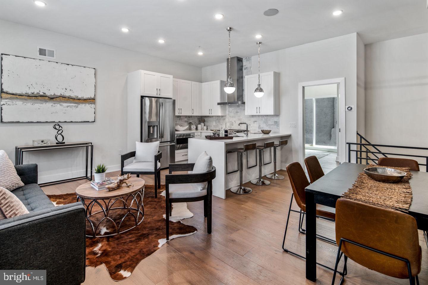 Get ready to be wowed by this stunning 3-bedroom, 3-bathroom condo and part of a luxury condo community. Ultra-luxurious, high-end new construction, with a backyard outdoor space. The first-floor features an incredibly modern yet elegant kitchen with seamless, soft-closing white shaker style cabinets and waterfall quartz countertops extend to a convenient breakfast bar, illuminated by large pendant lights. The 10 + ceilings create a dramatic effect to the living space. The modern chefs kitchen comes with stainless steel GE appliances with a gas range, Kohler Purist fixtures and white shaker style cabinets, offset by a luxurious Carrara marble backsplash. Your secluded private patio is accessed through PELLA sliding glass doors. Off the kitchen is a large bedroom, custom walk-in closet, and a monochrome ensuite bathroom with white cabinetry, quartz counters, hexagon tile floors, and matte black mullion shower doors. The lower level features another spacious bedroom with an ensuite bathroom and walk-in closet. A third bedroom with built in closet space and with full hall bathroom, laundry closet, and an open bonus space complete the level. This apartment has plenty of modern conveniences including a SONOS Sound system, NEST thermostat, and an AIphone Intercom security system with exterior cameras. Every floor is lined with gypcrete concrete and AcoustiCORK flooring to prevent sound penetration between each floor, a construction feature not commonly practiced in many buildings. Around the corner from the Francisville playground - perfect for pet owners. This prime Fairmount/Francisville location is steps away from Fairmount and has a Walk Score of 92. Nearby dining includes Telas, Bar Hygge, Rybread café, and Engimono Sushi. Nearby shopping includes Whole Foods, Target, and Fine Wines & Good Spirits. 5 years remaining on the tax abatement. 100% abated on the property assessment and annual real estate taxes below $1,000!