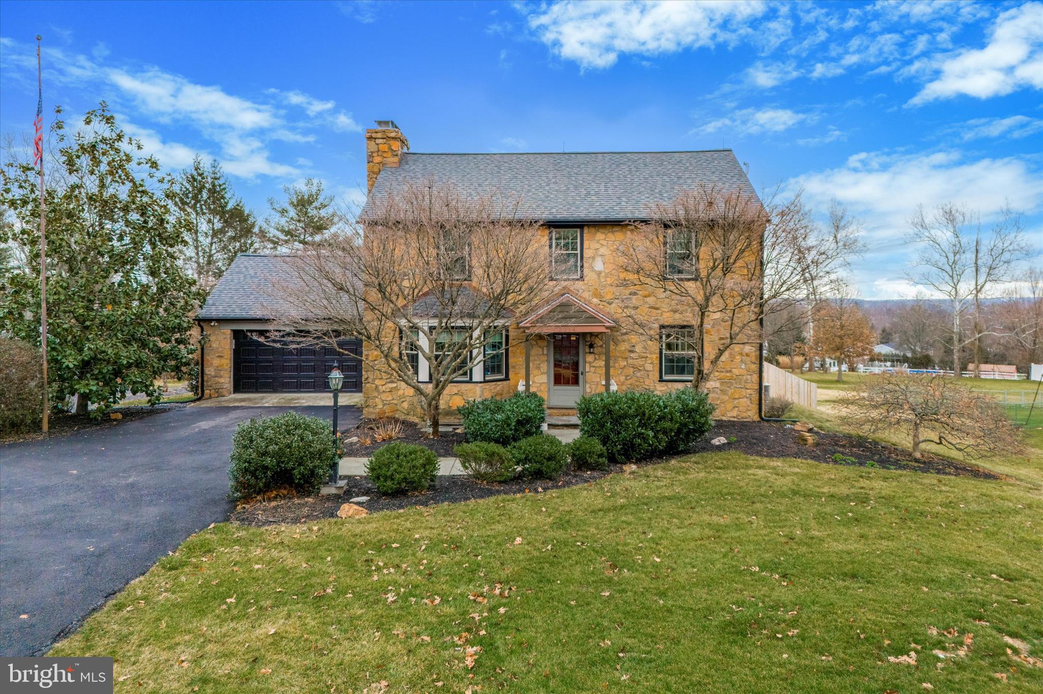 Welcome home! Don’t miss this 3-bedroom, 2.5-bathroom Colonial home in Eagleville with tons of updates and luxurious features! Situated on beautiful Whitehall Rd. with many magnificent homes, this property radiates an inviting vibe from the moment you roll up the driveway to this almost 1 and a quarter acre lot. The center hall entrance welcomes you with gleaming hardwood floors that extend through the hallway, living room, and dining area. A spacious and sunlit living room, featuring a black slate fireplace and built-in shelves, flanks the foyer. On the left side, an expansive dining room showcases beams and classic wainscoting. Continue into the well-equipped kitchen, boasting top-of-the-line black stainless steel appliances, marble countertops, a butcher block accent countertop, white tile backsplash, breakfast bar, pantry, and cathedral ceiling with a skylight. Off the kitchen, there is a wonderful sunroom with an exposed stone wall and a wall of windows overlooking the backyard—perfect for a breakfast area, relaxation or entertaining. A stylish and custom powder room completes the main floor. Head upstairs to find a spacious master bedroom, two equally spacious bedrooms, and a bonus room suitable for an office or craft room. All bedrooms offer ample closet space, while the gorgeously remodeled bathroom boasts a glass-enclosed stall shower with custom tile surround and a double vanity. There is a convenient laundry chute on all 3 levels of the home. The fully finished, walk-out basement, fully remodeled in 2021, provides an additional living space, featuring a 3-sided stone wet bar, an additional family room area with a wood stove, an office or gym area, a large laundry room with an extra outside entrance, and ample storage. A beautifully renovated second full bathroom completes this level. If you have a large family or love to entertain, the possibilities in this home are endless! The pool area in the rear yard provides a dream spot for outdoor relaxation and fun, complete with a stamped concrete patio, pavilion, grill station, fireplace, play area, and massive space for entertaining. This home also features a two-car garage with inside access, an oversized circular driveway, storage shed and has been proudly owned for the past seven years. The location offers unparalleled convenience, being close to major highways, shopping centers, parks, and top-rated schools. Whether you're commuting to work, exploring nearby amenities, or enjoying outdoor activities, everything you need is just a stone's throw away. Schedule your showing today!
