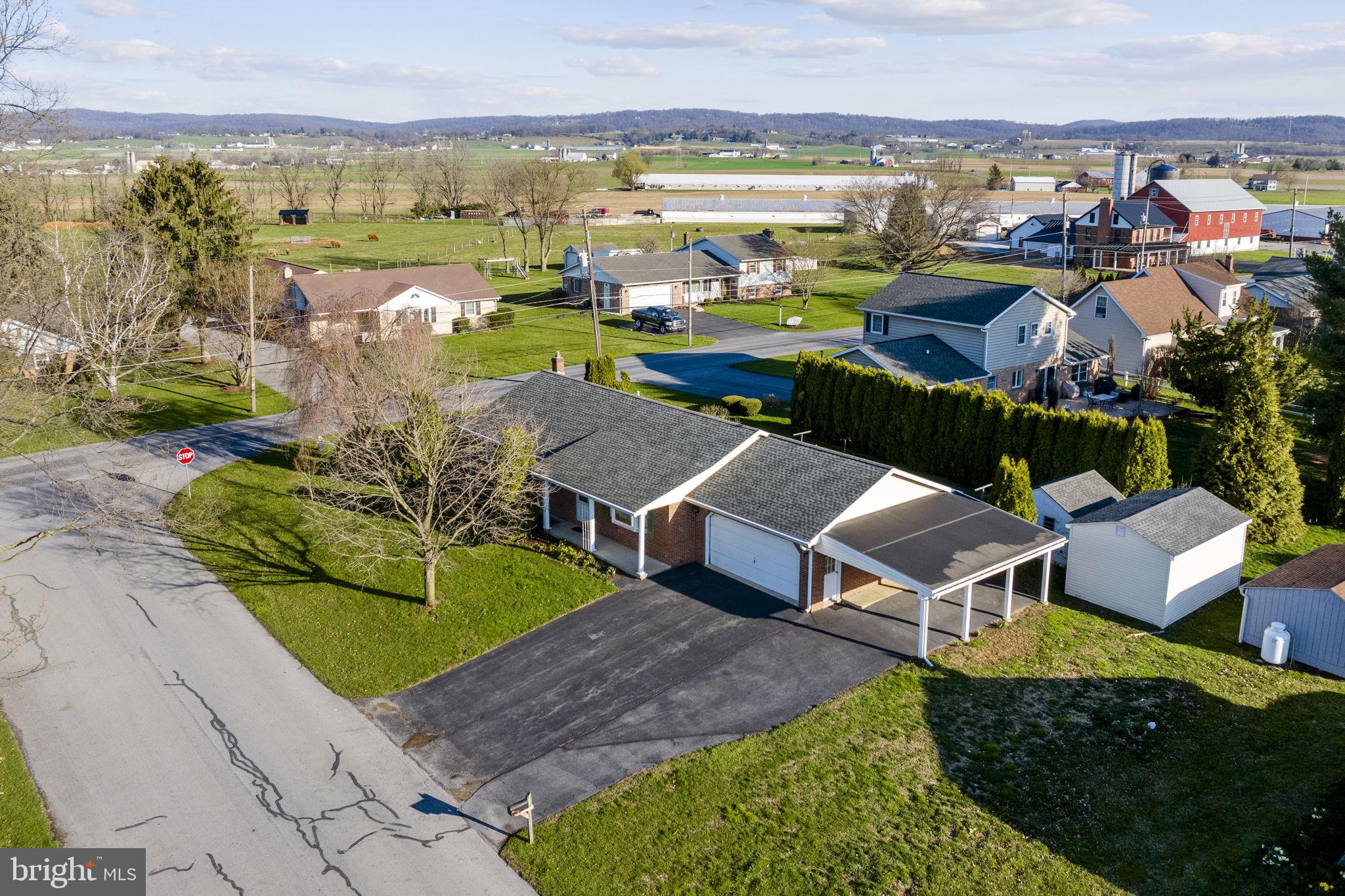 AUCTION DATE - THURSDAY, JUNE 11, 2026, AT 5 PM. LISTED PRICE IS AN OPENING BID ONLY AND IS NOT INDICATIVE OF THE FINAL SALE PRICE. REAL ESTATE: 1 sty. brick rancher w/2435 SF finished area w/eat-in kitchen w/birch cabinets, pantry & appliances, dining area w/slide door to rear patio, living rm. w/picture window, 1st floor laundry, 4 bdrms., 3 full baths, attic w/pull down steps, bsmt. w/finished family rm. w/stair lift, brick hearth w/propane stove, 2nd kitchen w/oak cabinets & appliances, storage rm. & outside entrance, electric baseboard heat, central AC (new 2024), water heater (new 2025), insulated windows, covered front porch, attached 2-car garage, additional carport 22x14 & utility bldg. 20x12 all on level 3/10 Acre corner lot w/double width macadam driveway, professional landscaping, privacy rear hedge, public water & sewer. NOTE: Owner downsizing to retirement quarters. Very clean, well-maintained rancher in well established residential area. Minutes to Clay, Ephrata, Lincoln, Rts. 322 & 272. Terms 10% down, balance 60 days or before. Personal inspection by appointment or open house Sat., May 23, 30 & June 6 from 1 to 4 PM.