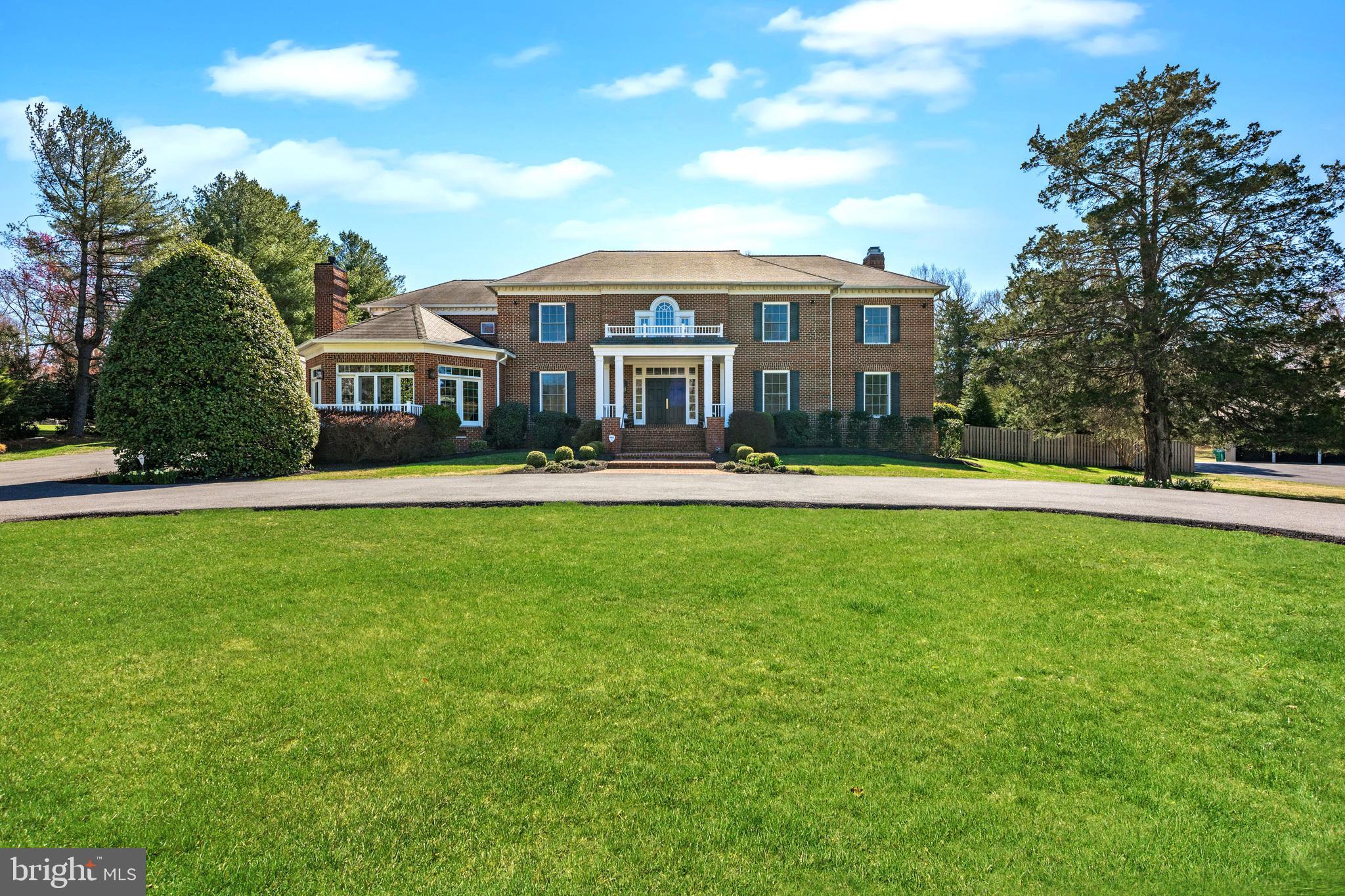 Every once in a while, a home comes along that stops you in your tracks--one that checks every box.  This IS that home!  Recently renovated and designed for modern living,  this handsome, almost 10,000 SF all brick colonial  seamlessly blends elegance with every day comfort.  As you arrive, you'll immediately be captivated by the exceptional curb appeal of this stunning estate.  The circular driveway welcomes you in, offering a wonderful first impression while providing both convenience and ample parking.  Sited on an expansive, beautifully landscaped property, this home exudes a sense of grandeur and tranquility with its stately presence and meticulous designed grounds setting the stage for what lies beyond.  Inside, soaring ceilings, a sweeping staircase, an expansive floor plan, and sun-drenched spaces create a warm and inviting atmosphere.  The Conservatory, formal Living Room and oversized Dining room create the perfect setting for gracious entertaining on a large scale.  The heart of the home is the stunning new kitchen and family room area, perfect for both relaxed living and big parties.  A back staircase adds extra convenience.   A secluded beamed sunroom with a gas fireplace is a great place to kick back and just breathe.  The always important mudroom includes laundry and the pool full bathroom. With a total of eight spacious bedrooms including a main level in-law suite (or a possible 2nd home office or exercise room), there's room for everyone.   Two offices provide space for those working from home.  The fantastic lower level features a spacious screening area for watching movies or the Final Four, a game room area for a billiard table, a ping-pong table or both while a cozy music nook provides the perfect spot to unwind.  With direct outdoor access to the backyard, this level extends the home’s living space.  Completing the lower level is the private au pair suite and full bath.  The home's five-car garage is a dream for car enthusiasts. But the true showstopper is the brand new Town & Country heated in-ground pool perfectly complemented by a pavilion with a stained wood ceiling, the outdoor kitchen with both a gas grill and the coveted Green Egg smoker - all set amidst the homes lush grounds.  This outdoor oasis offers the ultimate summer retreat where every gathering feels like a private resort experience.  There are just too many updates to mention.  You really need to see this one in person. Ideally tucked away on a quiet 2 acres just off the Persimmon Tree Corridor, this move-in ready home offers effortless access to the Beltway (I495), the BioMed Corridor (I270) and  downtown DC and both major airports.  Whitman school cluster.  Isn’t it time you made your move? Call to see this exceptional offering today!