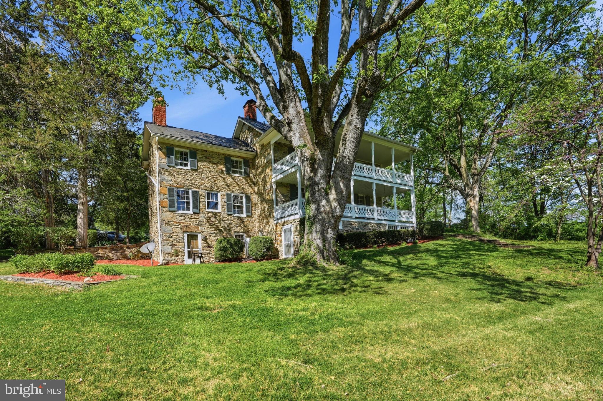 Winodee Farm - The historic George Tavenner house, built in 1788 and known as the first home built in Hamilton.  Sited on 5.64 acres, this amazing property is a wealth of Loudoun County history.  Built of local fieldstone with double porches, exposed stone walls, cupboards made of oak and heart pine, every nail made by the blacksmiths at the time, now is the chance to own this amazing piece of history.  Most of the home was built in 1788 with the kitchen, primary suite and lower level pub being added on in 1855.  The property consists of multiple outbuildings including a separate garage with tons of storage above, barn with stalls, potting shed, spring house and three fenced paddocks for the horses.