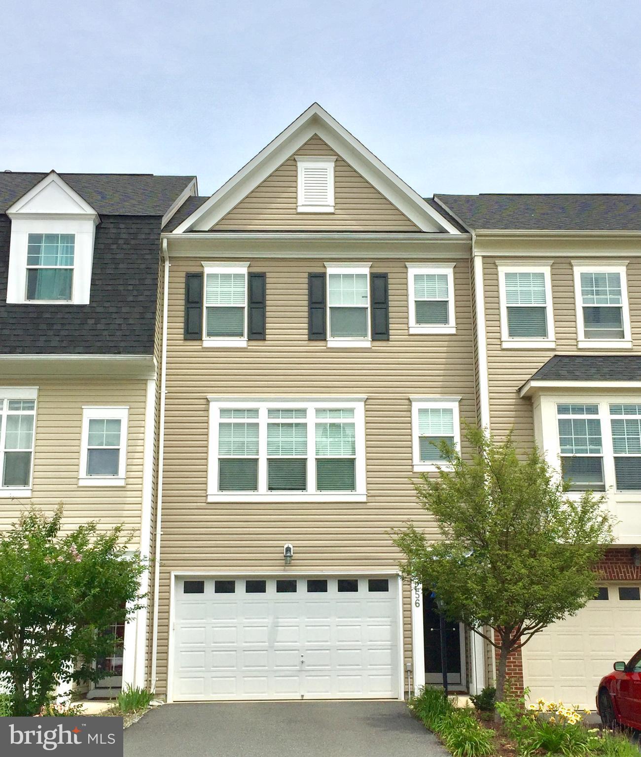 Well maintained townhome w/bumpouts on all levels just minutes to 95 and shopping/dining. Spacious kitchen joins family room with cozy fireplace. Gleaming hardwood floors tons of cabinets and counter space very open concept. Big deck for great entertaining. Finished basement is walk out level leads to patio area and good size fenced rear yard. Master has tub and shower and walk-in closet