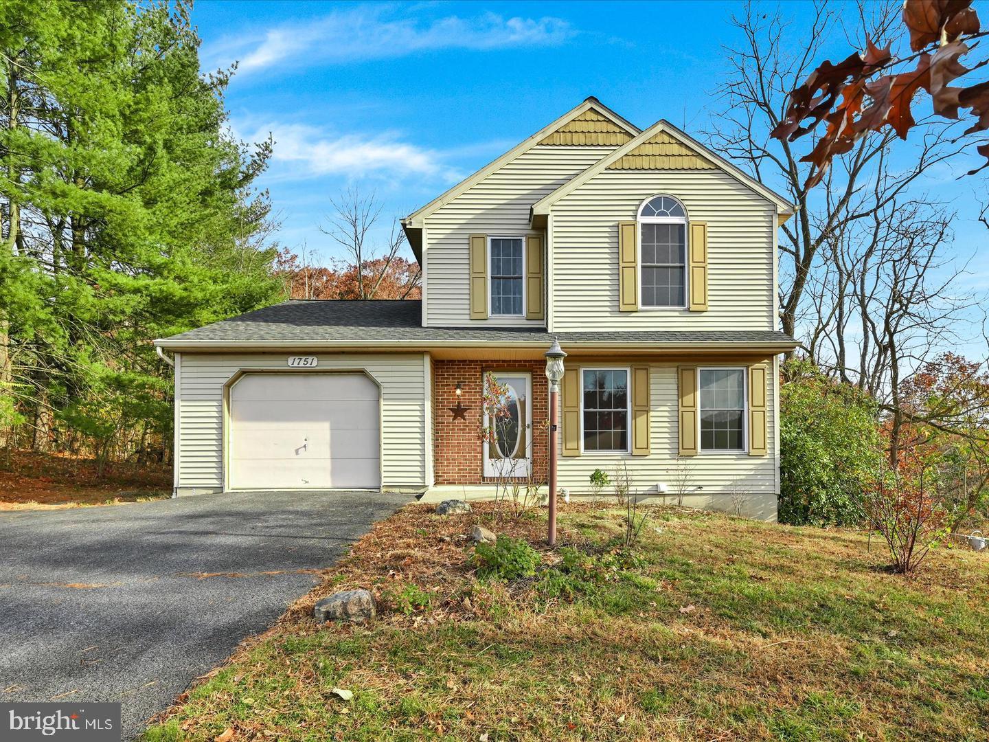 Welcome to this beautifully maintained 4-bedroom, 1.5-bath home, ideally situated on a quiet cul-de-sac in the highly sought-after Blue Mountain School District. Offering the perfect blend of comfort, character, and functionality, this home is ready for its next owner.

The spacious finished walk-out basement provides versatile living space, making it ideal for a family room, recreation area, home office, or guest retreat. Thoughtful updates include a newer roof installed in 2017 and replacement front windows, adding both energy efficiency and lasting value.

Inside, you'll appreciate the warmth and elegance of hickory hardwood flooring and ceramic tile throughout the main level, while the upper level features beautiful oak hardwood floors.

Step into the inviting three-season porch, where you can relax and unwind while enjoying peaceful views of the surrounding woods. Whether you're sipping your morning coffee or entertaining guests, this private outdoor retreat offers the perfect setting to enjoy nature year-round.

Don't miss this opportunity to own a move-in-ready home in a desirable neighborhood that combines privacy, convenience, and timeless appeal. Schedule your showing today!