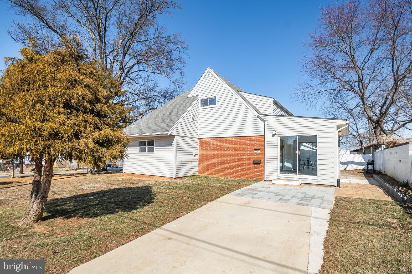 Contemporary Single Family Home with Main Level Bedroom. Home is minutes away from Metro, on a corner lot with parking area. This is a 4 Bedrooms and 2 Bathrooms dwelling, with plenty of natural light. Recent improvements include updated Kitchen, with Stainless Steel appliances, including Washer/Dryer. Nice open kitchen with new Cabinetry and Quartz countertops. Enjoy the large Living-room with  gas fireplace next to Dining room. Main level offers hardwood floors. Enter  the property through the inviting  Sunroom that offers dual access to concrete slab parking and backyard.  In the Upper Level, you will find two additional  bedrooms with  full bath  and attic storage.  Close to shopping , public transportation and major roads. This property qualifies for a$10,000 Non-Repayable Grant Program.
