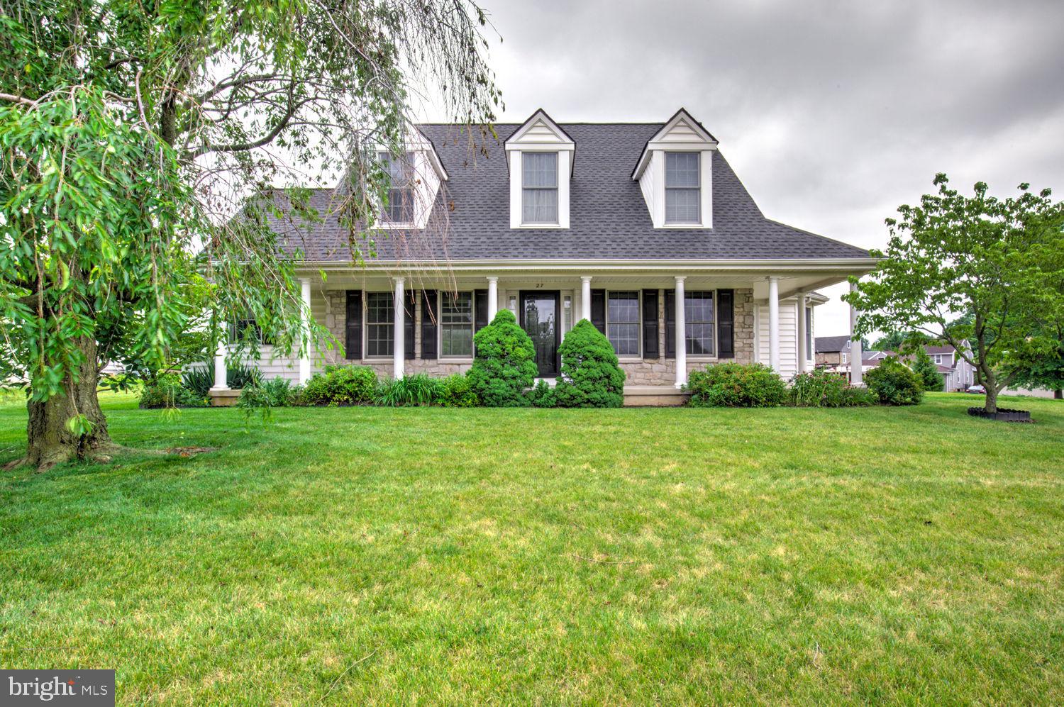 Welcome to this Charming Cape Cod style home in the heart of New Holland, The Willows. Offering 4 bedrooms, 2.5 bathrooms, and a welcoming front porch. Inside, hardwood floors flow throughout the front living room and kitchen, where you'll find an eat-in breakfast nook, separate dining area, and plenty of space for everyday living and entertaining. The spacious living room features a cozy gas fireplace flanked by two sliding glass doors, filling the space with natural light and providing easy access to the outdoors. A convenient first-floor laundry room adds to the home's functionality. Upstairs, each bedroom is accented by its own charming dormer, creating character and additional natural light. Complete with a 2-car garage and forced air central cooling, this well-maintained home offers comfort, charm, and a desirable location close to everything New Holland has to offer.