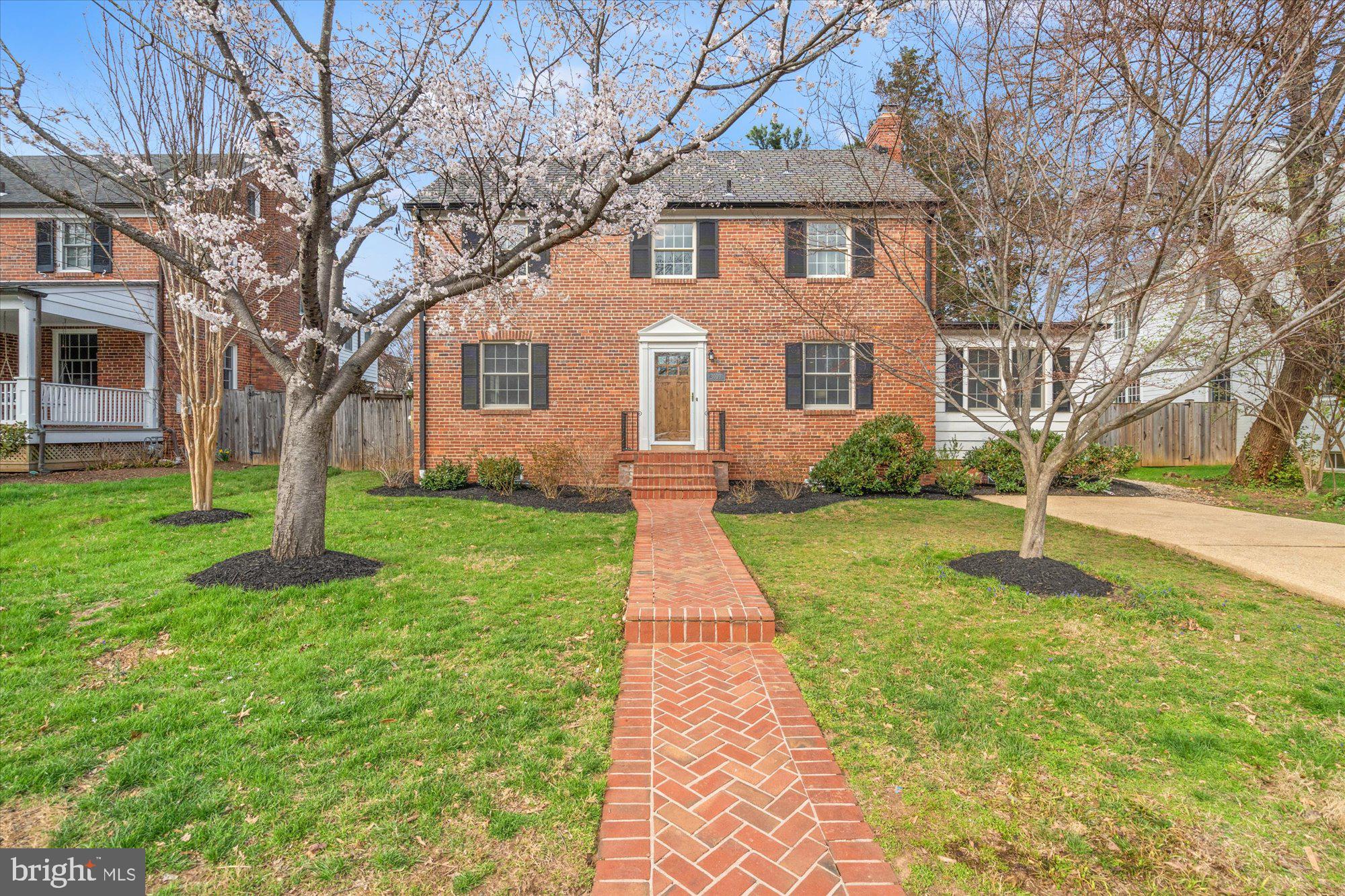 Nestled in the highly coveted Pinehurst Village neighborhood of Chevy Chase, this timeless, fully renovated center-hall Colonial blends traditional elegance with modern updates and exceptional proportions.  Set on a beautifully landscaped 0.2-acre lot, the home offers refined living with spacious interiors, abundant natural light, and gleaming hardwood floors throughout.  A gracious center foyer welcomes you home, flanked by a formal dining room that flows effortlessly into a brand-new, chef-inspired kitchen and a sun-drenched family room with direct access to an expansive stone patio and private, tree-lined backyard — ideal for seamless indoor-outdoor entertaining. To the right of the foyer, the generous living room features recessed lighting and a classic wood-burning fireplace, with easy access to a versatile main-level bedroom or home office, complete with an adjacent powder room.  Upstairs, three generously sized bedrooms offer comfort and style. The serene primary suite features an en-suite bath, while a beautifully appointed hall bathroom serves the additional bedrooms.  The newly renovated lower level delivers exceptional flexibility — a spacious family room, full bath, dedicated office nook, gym/storage area, and a large laundry room provide the space for every lifestyle need.  Ideally situated just steps from Chevy Chase Local Park and moments from neighborhood favorites including Brookville Market and the beloved La Ferme Restaurant, this home is also perfectly positioned within the coveted B-CC school cluster. A rare opportunity to own a beautifully updated Colonial in one of Chevy Chase's most sought-after neighborhoods — where timeless character meets truly modern living.