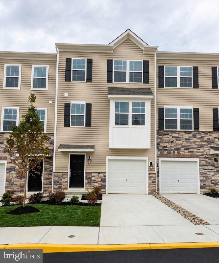 OCTOBER DELIVERY!  Discover the Lafayette floorplan, a thoughtfully designed three-story townhome offering nearly 2,000 square feet of versatile living space in the highly acclaimed Parkland School District. Begin your tour on the entry level, featuring a recreation room that doubles as a second living space. A one-car attached garage adds convenience and practicality. The heart of the home awaits on the second floor, boasting an open-concept kitchen, dining, and living area. The kitchen is perfect for entertaining, with direct access to a deck ready for your grill and outdoor gatherings. A powder room completes this level for ease and comfort. Upstairs, you'll find three bedrooms, including a luxurious owner's suite complete with an on-suite bathroom and walk-in closet. Completing this floor is a conveniently placed laundry room. Every home at Trexler Pointe is designed with modern living in mind, featuring stunning quartz countertops, sleek recessed lighting, upgraded flooring, and a state-of-the-art smart home package. Conveniently situated just minutes from major commuter routes like I-78 and Route 22, Trexler Pointe offers easy access to nearby cities such as Allentown, Bethlehem, and Easton. Whether you're looking for a new home or a lifestyle upgrade, Trexler Pointe combines quality, convenience, and comfort. *Photos are representative and colors may vary.