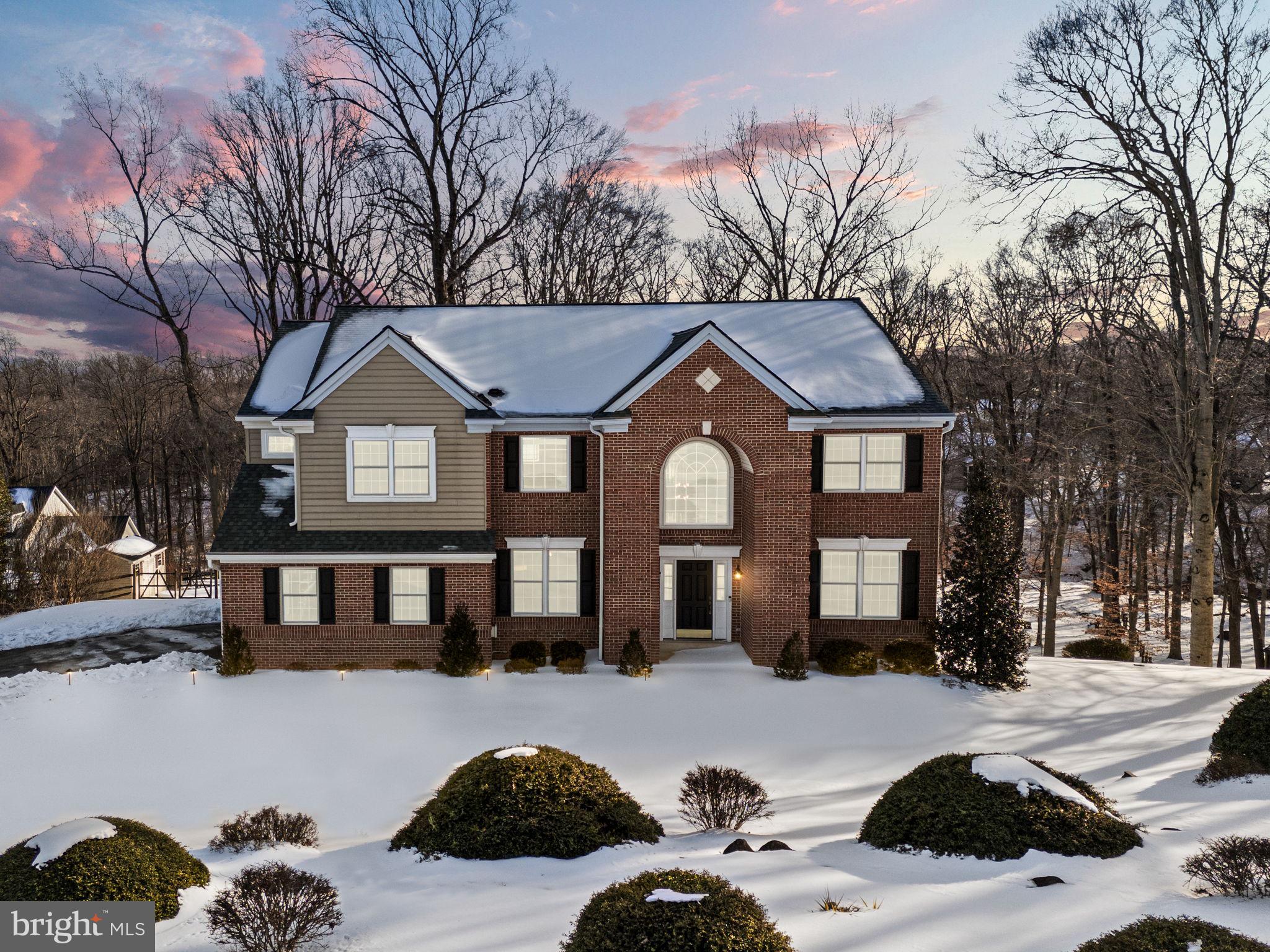Welcome to 3245 Sarum Farm Lane, Garnet Valley, an exceptional residence privately situated at the end of a quiet cul-de-sac on approximately 2.58 acres within the award-winning Garnet Valley School District. This impressive Iacobucci-built home offers 5 bedrooms, 4 full bathrooms, and 1 half bath, blending timeless elegance with high-end upgrades and outstanding indoor and outdoor living spaces.
A grand two-story foyer creates a striking first impression and leads into the formal living and dining rooms accented by custom architectural trim and rich hardwood flooring. The home has been thoughtfully upgraded with hardwood floors throughout the first and second levels, replacing all carpeting for a seamless, refined feel. Two staircases provide access to the upper level, both featuring refinished hardwood steps with new stair treads installed in 2023.
At the heart of the home is a beautifully redesigned chef’s kitchen ideal for everyday living and entertaining. It features quartz countertops, upgraded soft-close cabinetry, and a large center island with custom storage. A new Butler’s pantry with quartz surfaces adds both style and functionality. The kitchen also includes brand-new appliances installed in 2025 and additional electrical outlets added during the renovation. The bright morning and breakfast area flows into the dramatic two-story family room, where a wall of windows fills the space with natural light and overlooks the private backyard.
The main level also includes a private study with double-door entry, ideal as a home office, playroom, exercise space, or potential main-level bedroom. A spacious powder room and a well-appointed laundry room with a large coat closet and direct garage access complete the first floor.
Upstairs are four generously sized bedrooms, including a stunning primary suite with cathedral ceilings, a sitting area, two large walk-in closets, and a luxuriously renovated primary bathroom completed in February 2023. A princess suite features a custom walk-in closet and a beautifully remodeled private bathroom completed in March 2023. Two additional bedrooms share a Jack-and-Jill bathroom, while the hall bathroom was fully renovated in October 2025. A key-switch chandelier lowering system adds convenience to the foyer.
The finished lower level, completed in 2021, offers approximately 1,400 square feet of additional living space with large windows and a sliding glass door providing natural light and patio access. This level includes a bedroom and full bathroom, a spacious entertainment area with a gas fireplace and plumbing for a future wet bar, an exercise room or optional bedroom, a den or hobby room, and a large storage area with extensive shelving.
Major improvements include three renovated bathrooms, a new roof in 2024, and two zoned high-efficiency air-conditioning systems installed in 2024 and 2025. Additional upgrades include a new main water valve, updated recessed and exterior lighting, custom closet systems, new shutters, a hardwired security system, and an upgraded gutter and drainage system with engineered gutter guards. The garage also features a built-in workspace with a 12-foot counter, cabinetry, plumbed sink, and overhead storage racks.
Outdoor living is equally impressive with a top-of-the-line deck with RDI cable railing installed in November 2025 and a new paver patio completed in 2026. The expansive grounds create a unique private retreat with a fenced upper yard, volleyball court, horseshoe pit, and an updated treehouse finished with insulation, drywall, and electricity. A distinctive 9-hole disc golf course, running stream, and wooded surroundings provide a rare blend of recreation and tranquility. The property extends beyond the creek, as confirmed by the survey.
Offering privacy, extensive upgrades, and resort-style outdoor amenities, this exceptional property delivers an outstanding lifestyle in one of Garnet Valley’s most desirable communities.