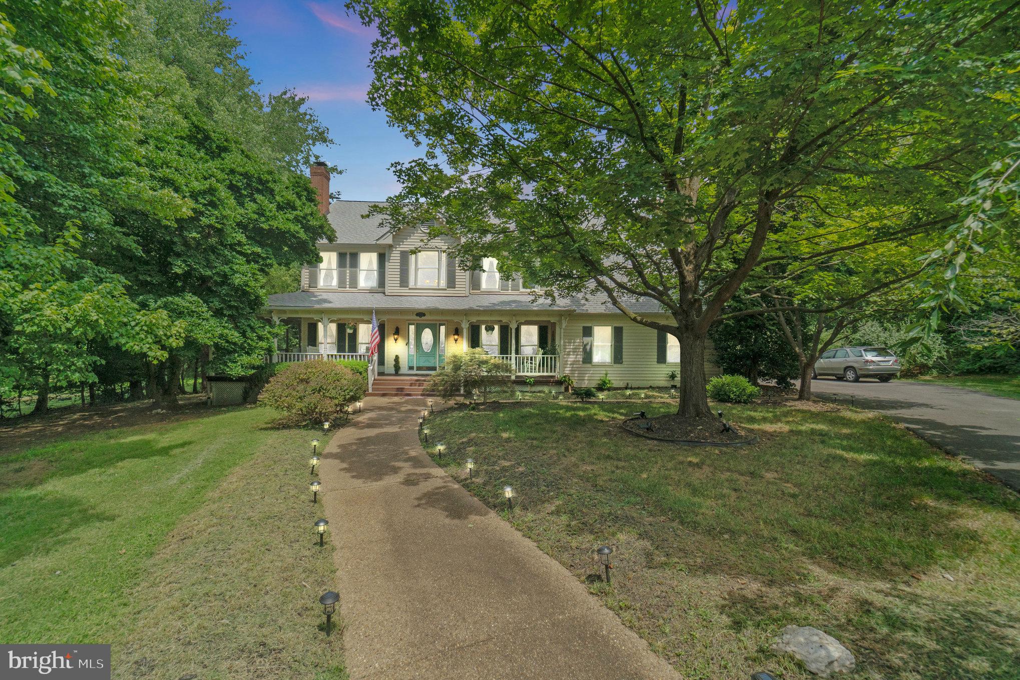 Welcome to 11256 Waples Mill Rd.  This luxurious Oakton home and property is waiting for it’s new owners!  Let’s get you in to this home while you can still enjoy the beautiful pool and spa!  Situated on 2.92 acres.  There is plenty of room for the whole family to have space to entertain.  Open kitchen to family room floor plan plus the ability to use the acre behind the pool for another house to occupy or sell. This is an incredible opportunity to live a life of elegance, comfort and tranquility. Step in and experience the unique and extraordinary design of this home.  See the unique detail including chandeliers, Tiffany-style lamps, crystal door knobs, ornamental leaded glass, custom trim, chair rail and wainscoting. The formal living room welcomes you with an ornamental leaded glass archway, inviting you into the splendid environment that has floor-to-ceiling windows, wood burning fireplace, tall ceilings and oak floors.  Move to  the formal dining room where your diners will be taken with the wall coverings, floor-to-ceiling windows, two-toned ceiling and antique chandelier. The home has a softer side, as is evident in the large, open, family room, excellent for relaxing evenings with family or friends by the wood burning fireplace or through the french doors, on the deck.  The laundry room is off the family room, for convenience and ease. The gourmet kitchen features a hand-hammered tin ceiling, Viking cooktop, double oven and warming drawer. Rounding out the gorgeous details is a Samsung counter-depth refrigerator, Samsung dishwasher,  Italian granite countertops/island and  a dining table. Finally, on the main level, there is a powder room and office with a wall of built-ins,  gold toned wall coverings, recessed lighting and  continuation of the oak floor. Upstairs, you will find the extraordinary primary suite with Schonenfeld Austrian chandelier and spacious dressing room both with vaulted ceilings and 2 walk-in closets plus another wall of built-ins. The renovated primary bath has a private commode, double vanity, frameless glass two person shower and skylights over the deep soaking jetted tub. The three additional bedrooms each have their own character and there’s something for everyone. Bold, vibrant textures and details in one, to softer tones in the next. Make them your own, there’s room for your personal touch!  An additional full bathroom provides for your family/guests. Downstairs, you’ll find a fully-finished, walk-out, lower level with full-sized windows. The space has a home theater (HD projector, movie screen and full surround sound all convey), as well as a 5th bedroom, kitchenette, full bathroom and space to add recreation/office/home gym/playroom or use as an in-law or nanny suite.  Situated on nearly 3 acres of pristine grounds, step out and take in the peace and tranquility provided by the strong tree line and the oasis provided by the fully fenced, heated, in-ground pool and hot tub with fountain and lights. What could you do with the rest of the land? Behind the pool, there’s room for a tennis/pickleball court, a small soccer pitch or a putting green.  Driving up the driveway, to the 2 car garage on the right side of the house, you’ll notice the traditional, covered wrap around porch. The driveway and secondary parking pad, provide an abundance of parking, amidst the gorgeous tree cover. Private well located on side parking pad provides free, pressurized water; perfect for all your landscaping needs, pool maintenance or consumption.  There are 2 unfinished attics ( 1 over the 2nd floor bedrooms and 1 over the garage) with potential to be finished spaces.  This home is located in the the sought after school zone of Oakton High School, Franklin Middle School and Waples Mill Elementary School.  It is also close to Flint Hill Private School.  Literally a couple of minutes from RT-50, I-66, Fair Oaks Mall, Wegmans and H Mart!  This home is a must see!! Schedule your showing today!