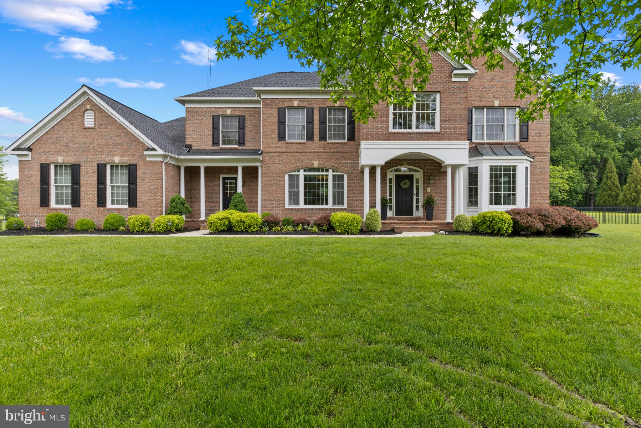 Located in an enclave of executive homes this stunning home is ready for new owners. Sited on over two parklike acres & surrounded by trees. The elegant entry is bound to impress . The Living Room & adjacent Dining Room with oversized molding & chair rail  and Butlers Pantry are perfect for formal entertaining . 
The recently renovated gourmet kitchen would delight any cook . Lot's of cabinetry , GAS cooktop, Double Ovens, Stainless Appliances & Granite Counters. The kitchen opens to a light filled sunroom with serene views. A custom  beverage bar with wine cooler and beverage refrigerator were recently added. The oversized family room offers a warm gas fireplace & custom built-ins. The den includes a custom built desk and cabinetry. The laundry room includes a "dog " shower. An impressive staircase leads to the upper level. The owners retreat with Sitting Room and Bedroom that will accomodate King Sized furniture. The  Bath includes  Garden Tub,  Dual Vanities , Shower and Walk-in Closet. Bedroom #2 has a Full Bath. Bedrooms 3 & 4 share a Jack & Jill Bath. The lower level is perfect for entertaining. Complete with a Custom Bar, Family Room,  Wine Closet, Au Pair Suite and slider that leads to the fully fenced rear yard. 
Improvements within the last 5 yrs: New 50 Yr Architectural Shingle Roof, New HVAC Systems, New well Pump,New Water Treatment System, New Shed with 60 Amp box, Kitchen Renovation & New Appliances,
All hard wd flooring refinished, New Family Rm TV Center, Beverage bar  with Wine Cooler & Beverage Fridge,Powder Rm Renovation, Laundry Rm  renovation with Cubbies & Tiled "Dog" Shower and Brick floor. Replaced Exterior Doors, Front, Laundry Rm ,Garage Entrance & Basement Slider.