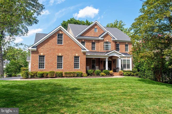Nestled in the highly sought-after Hansborough neighborhood of McLean, this beautifully updated custom brick colonial boasts an array of coveted amenities and a flexible floor plan that caters to every need. The main level welcomes you with a charming covered front porch and a grand two-story foyer . A true, updated large chef's kitchen is adorned with an oversized center island, beautiful cabinetry, new countertops, a stunning backsplash, and updated appliances. The breakfast room leads seamlessly to a low-maintenance composite deck, while the family room offers coffered ceiling and a gas fireplace with a raised stone hearth. The main level also hosts a formal living room and dining room, a versatile bedroom/office with a full bathroom, as well as a convenient, fully functional and practical mudroom that leads to a three-car garage. Ascending to the upper level, you'll discover a luxurious owner's suite retreat with a sitting room, two walk-in closets with flexibility to set one up as a second home office, and a spa-like bath with a soaking tub, a walk-in shower, dual vanities, and a private water closet. Three additional bedrooms, two full baths, and a renovated upper-level laundry room provide comfort and convenience. The walk-out lower level, with expansive windows providing natural light, is designed for entertainment and relaxation, featuring a built-in bar, a spacious family and game room with a gas fireplace, a powder room, an additional spacious bedroom and full bath, an exercise studio, and ample storage space. There are many luxurious features like  3-car garage, 10-foot ceilings on the main level, 9-foot ceilings on the upper and lower levels, and updated fixtures, lighting, vanities in bathrooms, new carpet, and flooring, as well as a generator. The property is situated on a spacious corner lot on a quiet street. Its elevated deck, fenced rear yard, and patio present endless opportunities for outdoor enjoyment. Situated mere steps away from McLean Central Park and the McLean Community Center, this home offers unparalleled convenience. A commuter's paradise, it's just minutes from the beltway, Metro, DC, and Tysons, ensuring effortless access to urban and recreational destinations alike.