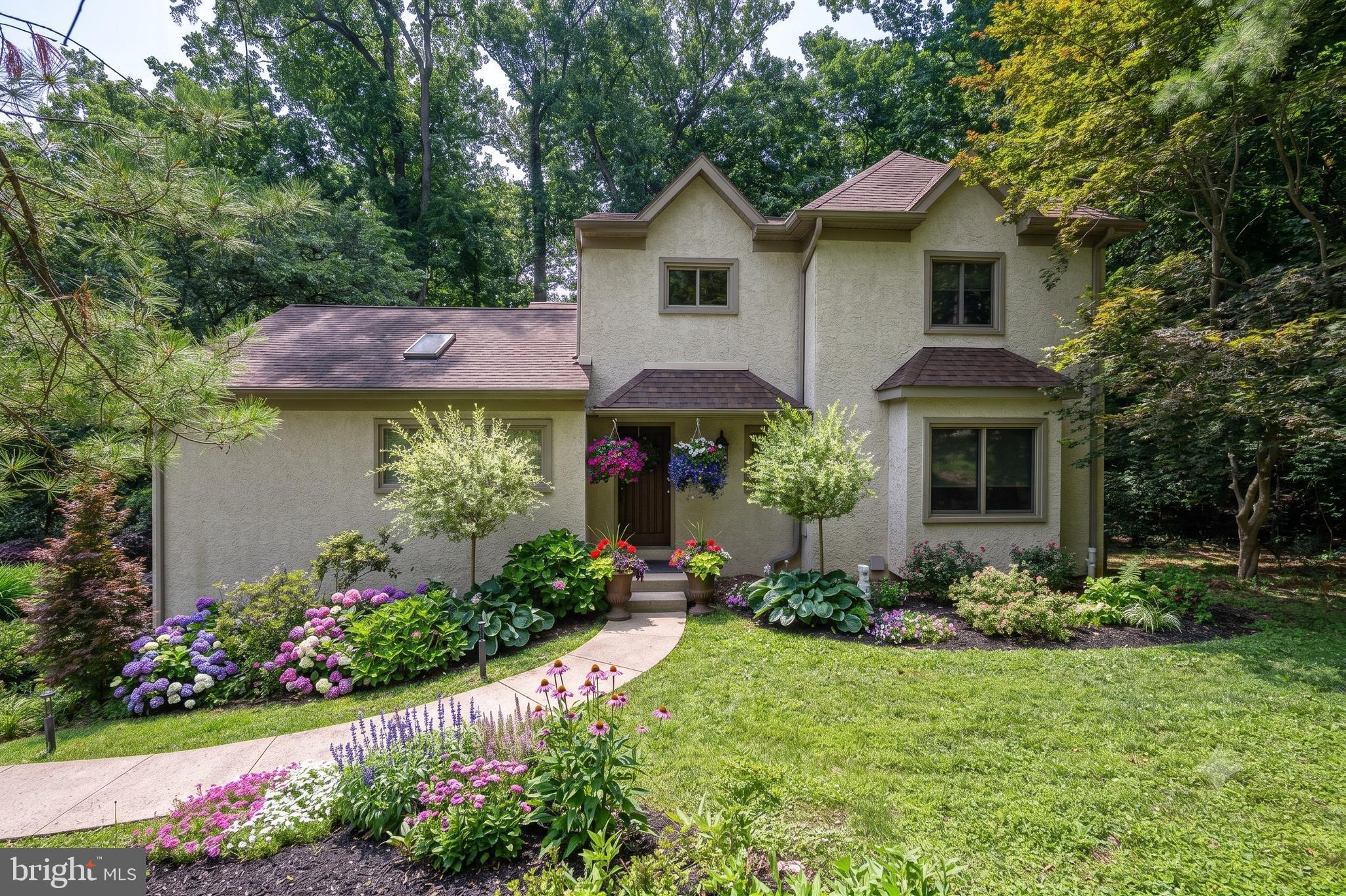 Nestled in the serene Meadowbrook neighborhood, this exquisite Colonial-style home offers a perfect blend of luxury and comfort, ideal for those seeking an elevated lifestyle. Built in 1994 and thoughtfully renovated in 2020, this home boasts a timeless elegance with modern amenities that cater to today's discerning homeowner. As you step inside, a warm and inviting atmosphere greets you, enhanced by rich hardwood flooring, two story foyer and abundant natural light streaming through the windows and skylights. The spacious layout features four generously sized bedrooms and three full and one half bathrooms. Convenient first floor  primary suite offers a beautifully remodeled bathroom  with a walk-in shower, tiled floors, skylight and upgraded countertops. The large primary suite features a skylight, three closets, an ensuite, cathedral ceilings and access to the deck overlooking the rear grounds! On the second floor there is an additional suite with an ensuite that has a remodeled bathroom with a shower/tub. Two additional bedrooms share access to a remodeled Jack and Jill bathroom.   The heart of the home is the gourmet kitchen, designed for both functionality and style. It features a large island, sleek GE Cafe appliances, gas cooking a tiled backsplash granite countertops, tiled floors and ample room for table space, making it perfect for casual dining or entertaining guests. Sliding doors provide access to the beautiful deck. The adjoining living room creates an inviting space perfect for relaxation and gatherings! Easy access to the spacious formal dining room is also available, ensuring that every meal can be enjoyed in style. The flow of these rooms makes entertaining at large holiday gatherings a breeze.  The finished basement offers endless possibilities, whether as a home gym, media room, or play area. Cozy up to the fireplace and enjoy plenty of room to entertain or just hang out and watch the game or binge watch your favorite shows. Step outside to discover the expansive outdoor space, set on a sprawling 1.53-acre lot. The hardscape and beautiful landscaping create an enchanting ambiance for evening gatherings, while the sport /basketball court invites active play and leisure.  A charming shed provides additional storage, ensuring your outdoor space remains tidy and organized. It also doubles as a fully outfitted bar with electricity, perfect for entertaining by the fire pit and enjoying nature with friends and family! This home also features a side-entry attached garage for two vehicles and a paved driveway accommodating five additional cars. Located in a suburban oasis, this property is conveniently situated close to multiple train stations, making commuting easy. Experience the perfect blend of luxury, comfort, and convenience in this stunning Meadowbrook residence, where every detail has been meticulously crafted to create a true sense of home. Commute quickly to Center City, the Western Suburbs, NY and Shore Points with easy access to 95, 476 and the Turnpike. Enjoy local shopping at Whole Foods and Trader Joes close by as well as area Hospitals and Universities.