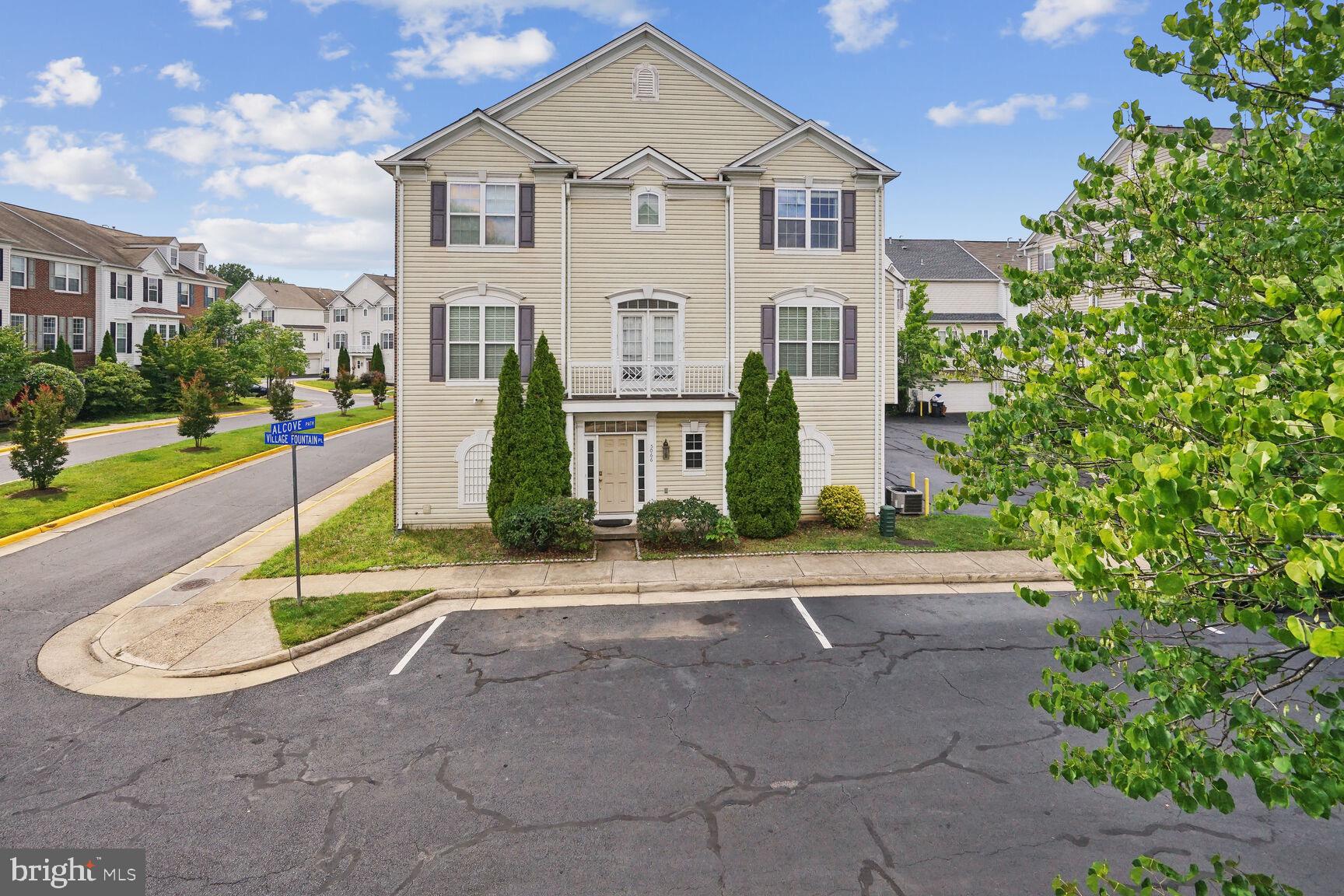 Welcome home to this stately end-unit garage townhome in the highly sought-after Faircrest community! Offering over 2,100 square feet of beautifully finished living space across three spacious levels, this home combines comfort and convenience. The entry level features a versatile office or bonus room, a convenient half bath, and a laundry room. Upstairs, the sun-filled main level is designed for both everyday living and entertaining, showcasing a gourmet eat-in kitchen with granite countertops, white cabinetry, stainless steel appliances, and a center island. The adjoining living and dining areas are enhanced by hardwood floors and elegant crown molding. Retreat to the upper level, where the spacious primary suite offers a large walk-in closet and a luxurious en-suite bath with a double vanity, soaking tub, and separate walk-in shower. Two additional bedrooms and a full hall bath complete this level. Additional highlights include a desirable side-load two-car garage with easy access. Freshly painted. Ideally located just minutes from shopping, dining, commuter routes, and I-66, this exceptional home offers the perfect blend of convenience and community living.