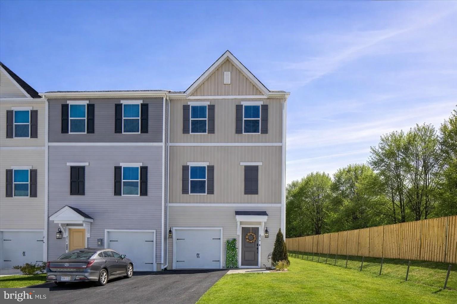 Why wait for new construction when you can move right into this nearly new end-unit townhome in Liberty Run? Built in 2025 and gently lived in, this home offers the modern finishes, layout, and style buyers want — without the build-time delays.
The walk-in level features a true bedroom with a full bath, creating a private suite separate from the main living areas. With direct backyard access, this level works perfectly for guests, a quiet office, hobby room, or personal retreat.
Upstairs, the main level shines with wide-plank luxury vinyl flooring, abundant natural light, and an open-concept design. The gourmet kitchen includes upgraded quartz countertops, white shaker cabinets, stainless steel appliances, subway tile backsplash, and a large center island with seating — ideal for cooking, hosting, and everyday living. The adjoining dining and living spaces flow effortlessly and feel warm and inviting.
The upper level offers three additional bedrooms and two full baths. The primary bedroom includes a large closet and a private bath with ceramic tile and upgraded fixtures. Secondary bedrooms are comfortable and versatile, perfect for kids, guests, or additional workspace.
The back of the home backs to open common area with a wooded view on the side, offering more privacy than typical townhome living — you’re not looking directly into another row of homes. The driveway offers ample parking and can easily accommodate two vehicles.
Close to shops, restaurants, and major commuter routes including Route 9 and I-81. Welcome home.