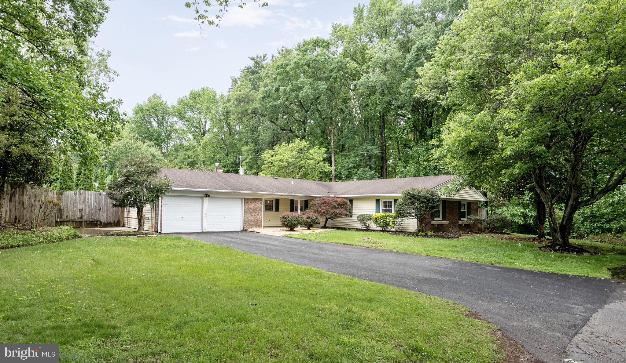 Nestled among the trees adjoining parkland, one level living at it's best!    Great for gatherings and entertaining in your own private oasis.   Nearly a half acre!  Open kitchen and family room with recessed lighting, large kitchen lsland / breakfast bar, Stainless appliacnes, built-ins, plenty of cabinets.  Brick fireplace in the family room and in the living room.  4 spacious bedrooms and 2 full baths.  No Steps! Tucked away in the heart of everything, Greenbriar, Fair Lakes, Fair Oaks, shopping just minutes away.  Transportation options all close by  Rt 50, Rt I66, Fairfax County Parkway, Rt 29, and the commuter bus.