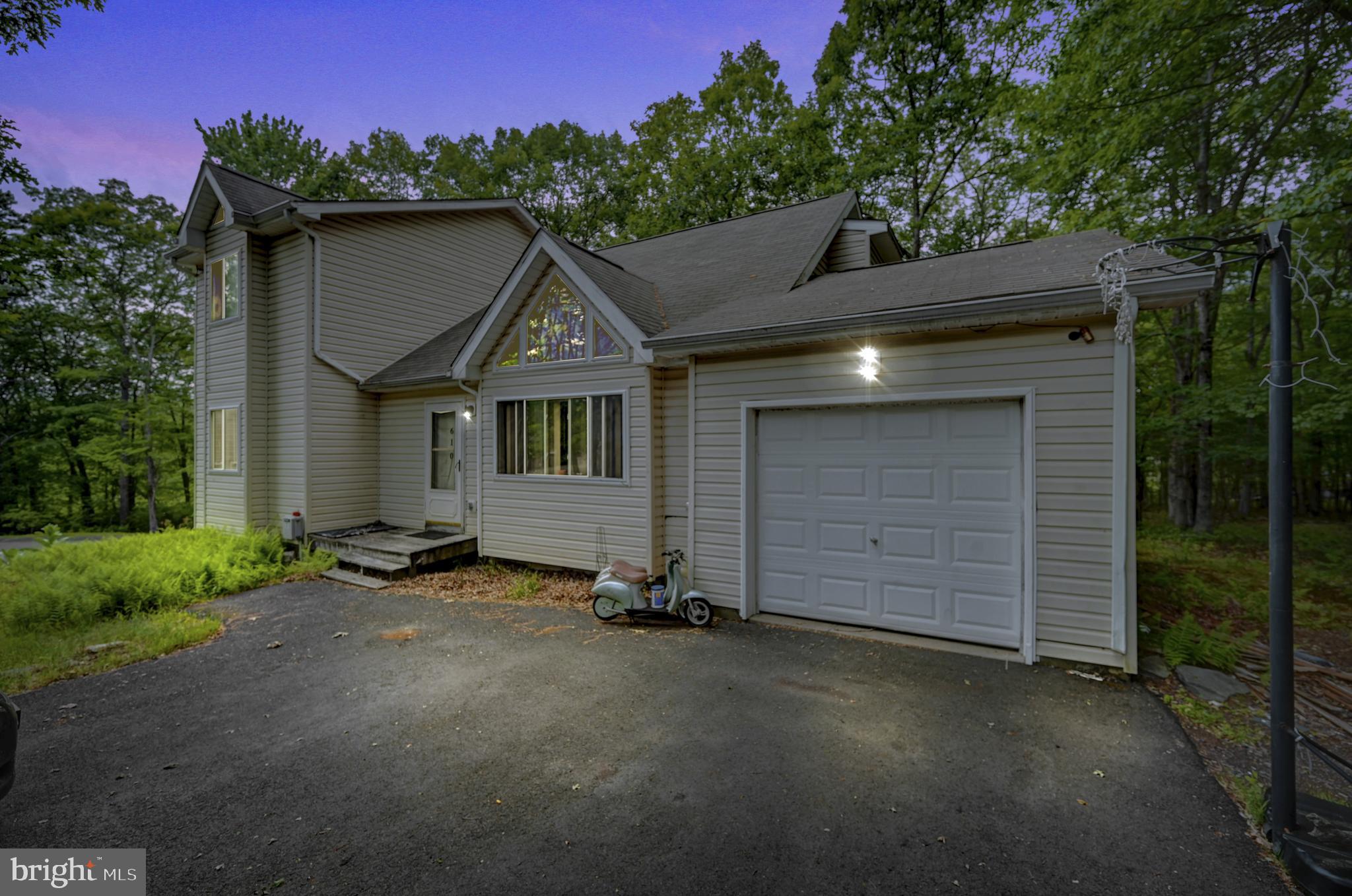 A great value opportunity to own your own home in Glen at Tamiment! Peaceful and Safe Gated Community this will make a great starter home for your young family! Roll up your sleeves, bring your hammer and paintbrush and make it your own! This contemporary is a 4 Bedroom 2 Full Bath with Garage on a partially cleared .43 Acre and Cul-De-Sac. Vaulted Ceilings and Laminate Flooring in the Living Room and Sitting room on the second floor. Open concept Dining/kitchen area with a deck off the back! AS-IS SALE and priced accordingly.