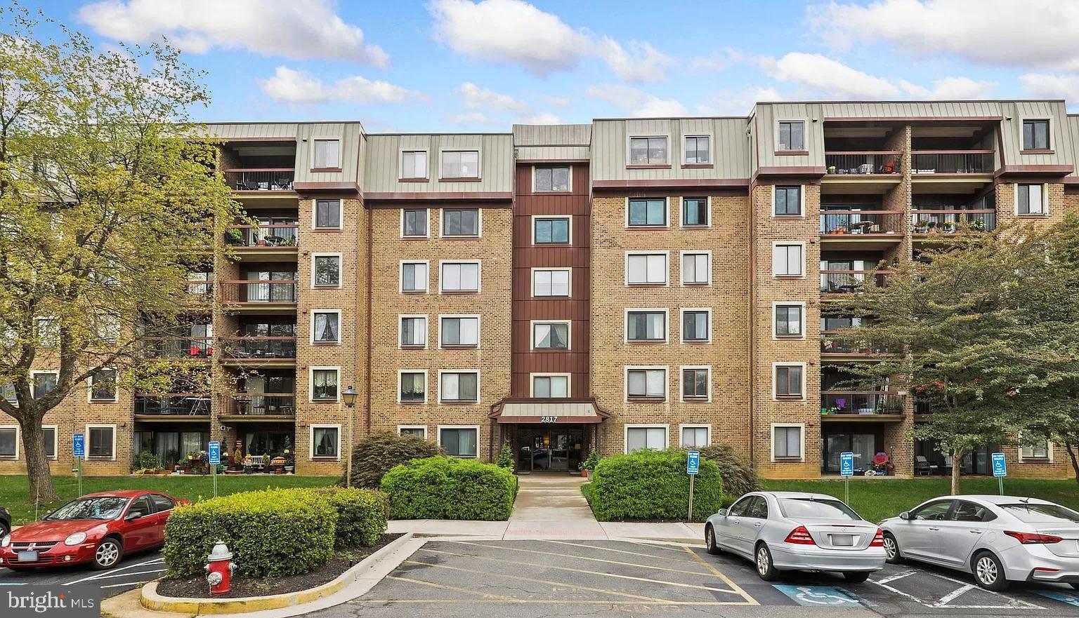 Don't miss this spacious 2BR 2BA condo located in the heart of Oakton. Living and dining room combined makes a large living space.  Total 1350 sqft. Two nice size bedrooms with vanity and newer shower and toilet in primary bedroom.   Separate laundry room with hookups for washer and dryer.  Second bathroom has tub/shower.  Kitchen appliances are all working however they are sold "as is".   Building requires key entry and has an elevator to take you to the second floor unit. Ample surface parking.   Bus stop in front of building.  Conveniently located to I-66, Vienna metro, Tysons Corner, Fairfax and both National and Dulles airports.