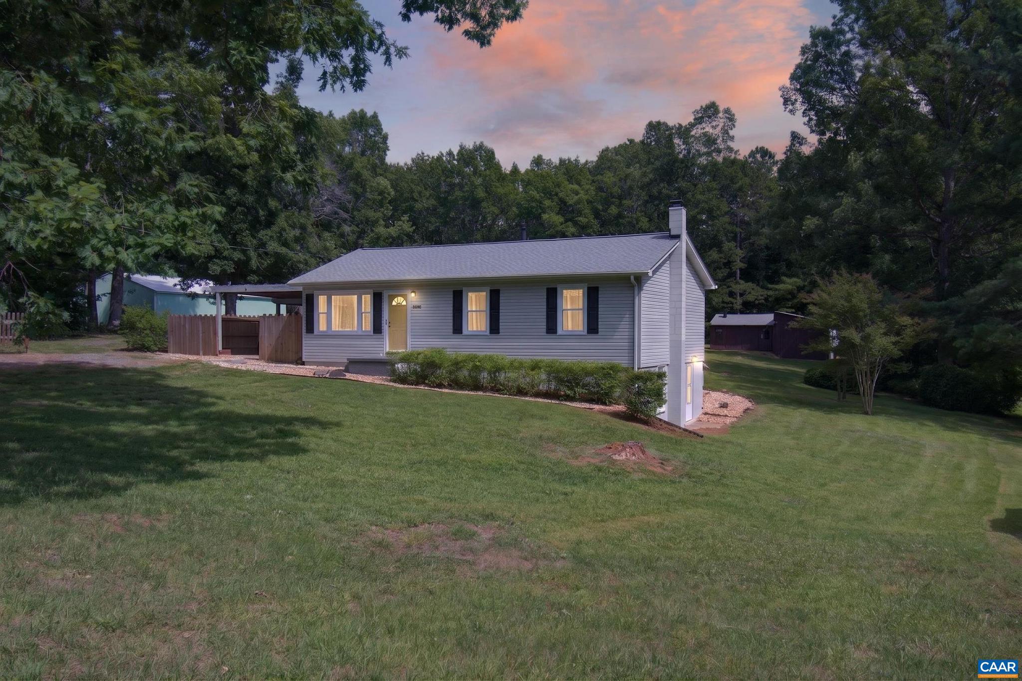 Convenient country living just 7 miles from Rivanna Station! This well-maintained ranch home sits on 1.3 acres and offers the perfect blend of comfort, flexibility, and outdoor space. Major updates have already been taken care of, including a new roof and vinyl replacement windows. Inside, the main level features a spacious living room, bright eat-in kitchen, two bedrooms, and a full bath. The home is served by a 3-bedroom septic system, providing the opportunity to convert it back to a three-bedroom layout if desired. The walk-out basement adds even more living space with an oversized family room featuring both a wood-burning fireplace and wood stove, a second full bath, laundry area, and a versatile flex room ideal for a home office, hobby room or guest space.  Step outside and enjoy the 12' x 12' screened porch, covered brick patio, detached workshop with electricity, chicken coop, and plenty of room for gardening. Whether you're dreaming of a small farmette, a place for projects, or simply room to spread out, this property offers endless possibilities. Located less than 3 miles from Route 29, you'll enjoy an easy commute while still having the privacy and space of country living.,Fireplace in Family Room