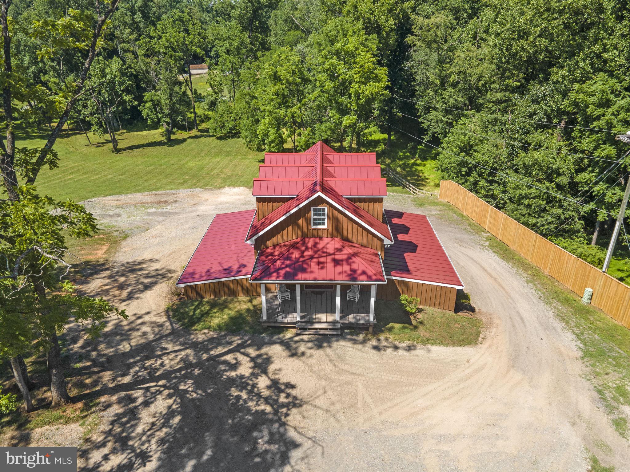 This is a rare opportunity to build your ultimate dream home while living in a beautifully appointed, 3 level, 1 Bedroom, 2 full Bath on-site Barndominium Cottage with garage/storage/ready-to-be-finished space on the lower level. The cottage (newly constructed) sits adjacent to an existing fixer upper / tear down (former girl’s school manor house (built in 1925)), if you would like to see the manor house please arrange private tour with listing agent)).  
This is one of the last and best, prime 10 (Ten) acre lot(s) in the Clifton area. This. sale includes two parcels with tax ID's 0751 01  0026A & 0751 01  0026B. 
The scenic parcel is situated on a hilltop overlooking a fantastic wooded westward facing view. The lot which is surrounded by woods is cleared and ready for your dream home. No costly tree removal during your build. The property has a 6-bedroom perc for the septic system (see Cert Letter in docs).  Newly installed well with a 30GPM yield!. 
This property is a dream come true for someone looking for a ready to build lot.  Bring your builder, architect or contractor to determine your perfect house design to best enjoy the lovely sunset views.  Schedule a showing and come take a look at what is your perfect Clifton location. Walk the property. Plenty of room for equestrian activities for those who love horses. No HOA.  
Just 6 minutes from the historic downtown Clifton town-center via Compton and Clifton Roads. Located only minutes to Union Mill, Braddock Road, Route 29, I-66 and Fairfax County Parkway.