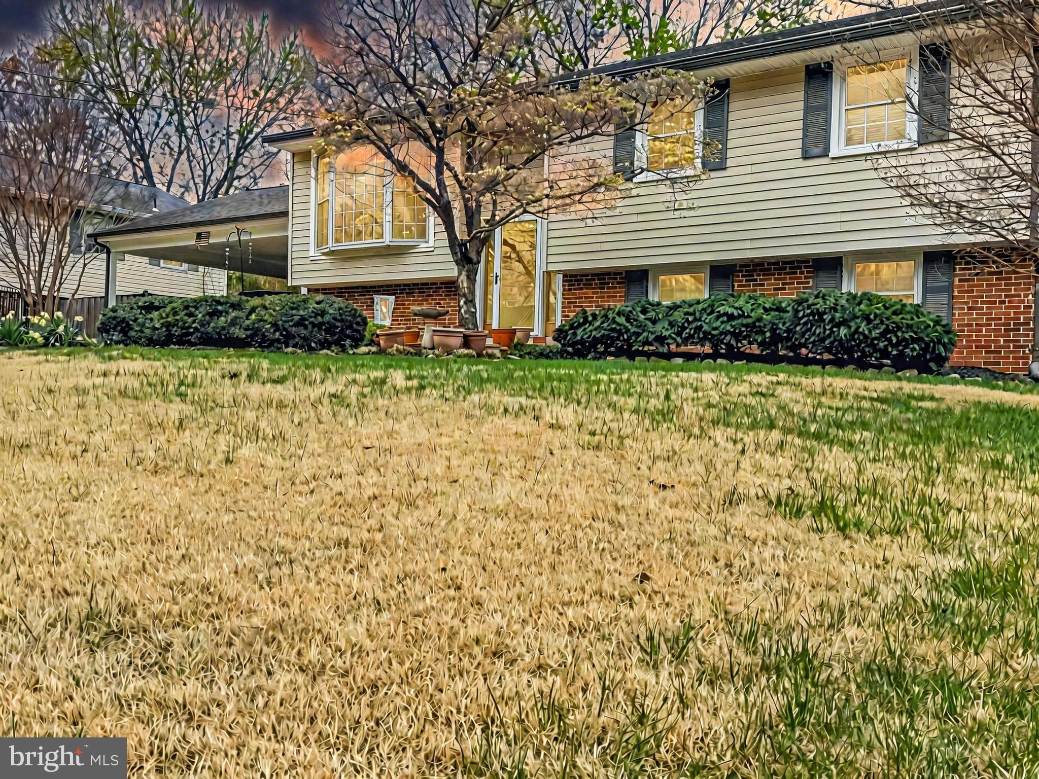 Welcome home to this well-loved, stunning split-level residence in Country Club Manor.  Boasting 4 bedrooms, 2 full bathrooms and offering ample space for families and guests alike.  Step inside to find spacious kitchen with bump out featuring granite countertops, abundant cabinetry including an island... perfect for the home chef.  Off the kitchen you'll find the separate dining area and cozy family room full of light.  The primary bedroom along with two other bedrooms are located on the upper level with a full bathroom.  The lower level provides a recreation room with built in shelving, a fourth bedroom, oversized laundry, workshop and easy, walkout access to the large, private backyard - an ideal setting for entertaining friends and family.  Enjoy the additional perks of the screened in porch overlooking it all.  With a 2 car attached, covered carport, no HOA fees this home combines comfort and stye.  Quick access to I-66, R29, R28, Dulles Airport and shopping.  Don't miss your chance to own this beautiful property in a prime location.