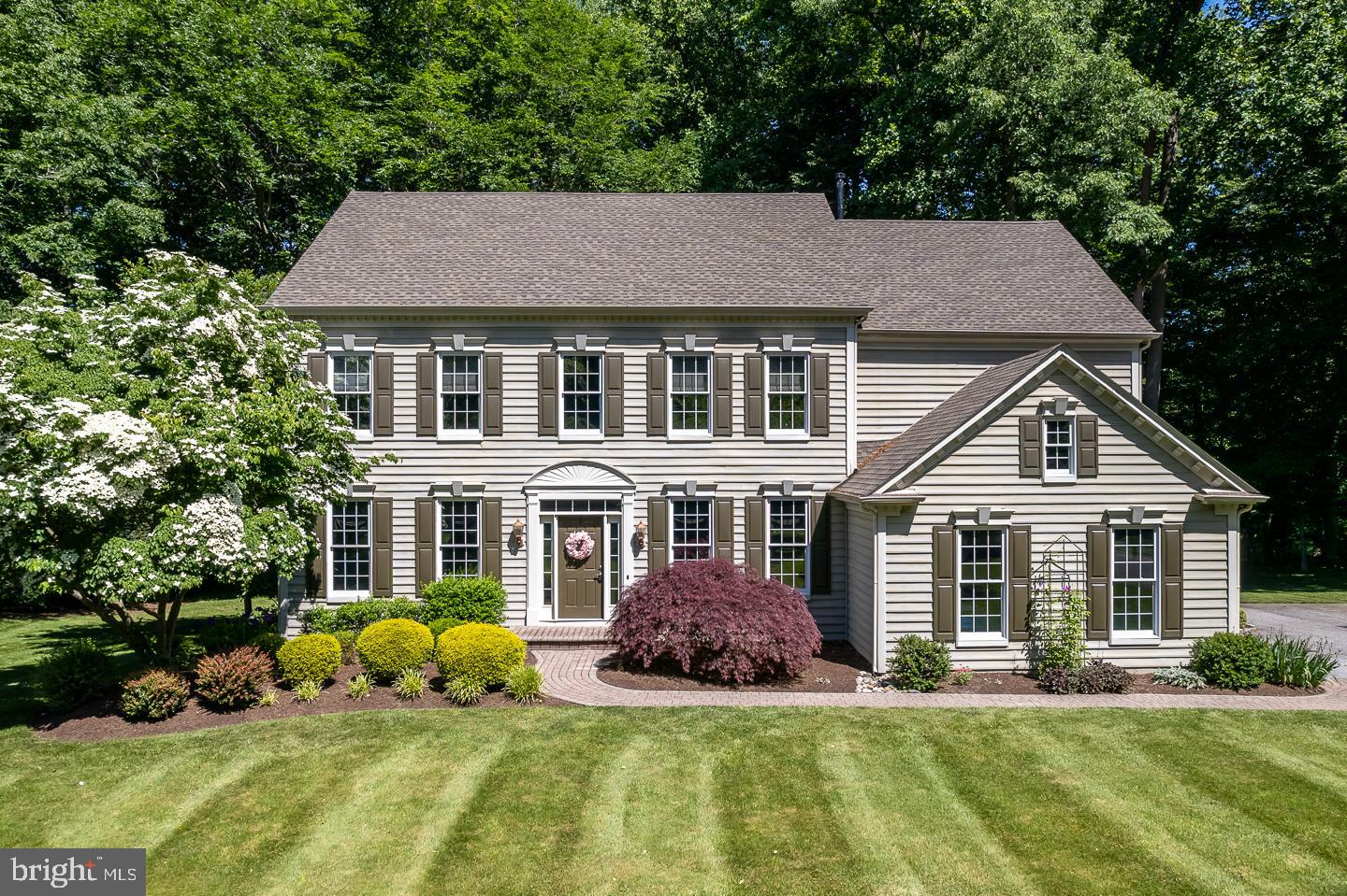 Brookside, perhaps one of the most sought after addresses within Garnet Valley. It's quiet, walkable and very pleasing on the eyes as this neighborhood is gorgeous. But just wait, the elegance and sophistication of this fine home is beyond measure. The original owners have painstakingly loved this home and maintained it meticulously throughout their tenure. We all know about real estate, it's the location and then it's the kitchen, don't miss this one! Gleaming granite counters, Wolf 6 burner commercial cooktop, Kitchen Aid double wall oven, wine chiller, stunning backsplash and the microwave is conveniently located in the center island. From the moment you walk into the gracious foyer you will feel right at home, and what's not to love, new engineered hardwood floors throughout the first floor, a generous display of fine moldings, two story family room with gas fireplace, new powder room and a new laundry room that will get you excited to wash clothes! Spacious primary suite with tray ceiling, large walk in closet and newer ensuite  with Jacuzzi Whirlpool and newer tiled shower. three additional bedrooms and two new bathrooms that were very tastefully designed. The lower level has a game room area and an deal spot for family movie night. There is a workshop and plenty of storage areas. The timing is just right for outdoor fun and you will love the setting which is open lawn area and partially wooded in the rear, you can savor this scenery from your maintenance free Timberteck Deck.  Newer roof and newer HVAC systems, lawn sprinkler that covers the front rear and side yards. An amazingly beautiful  home ideally situated in the perfect location!