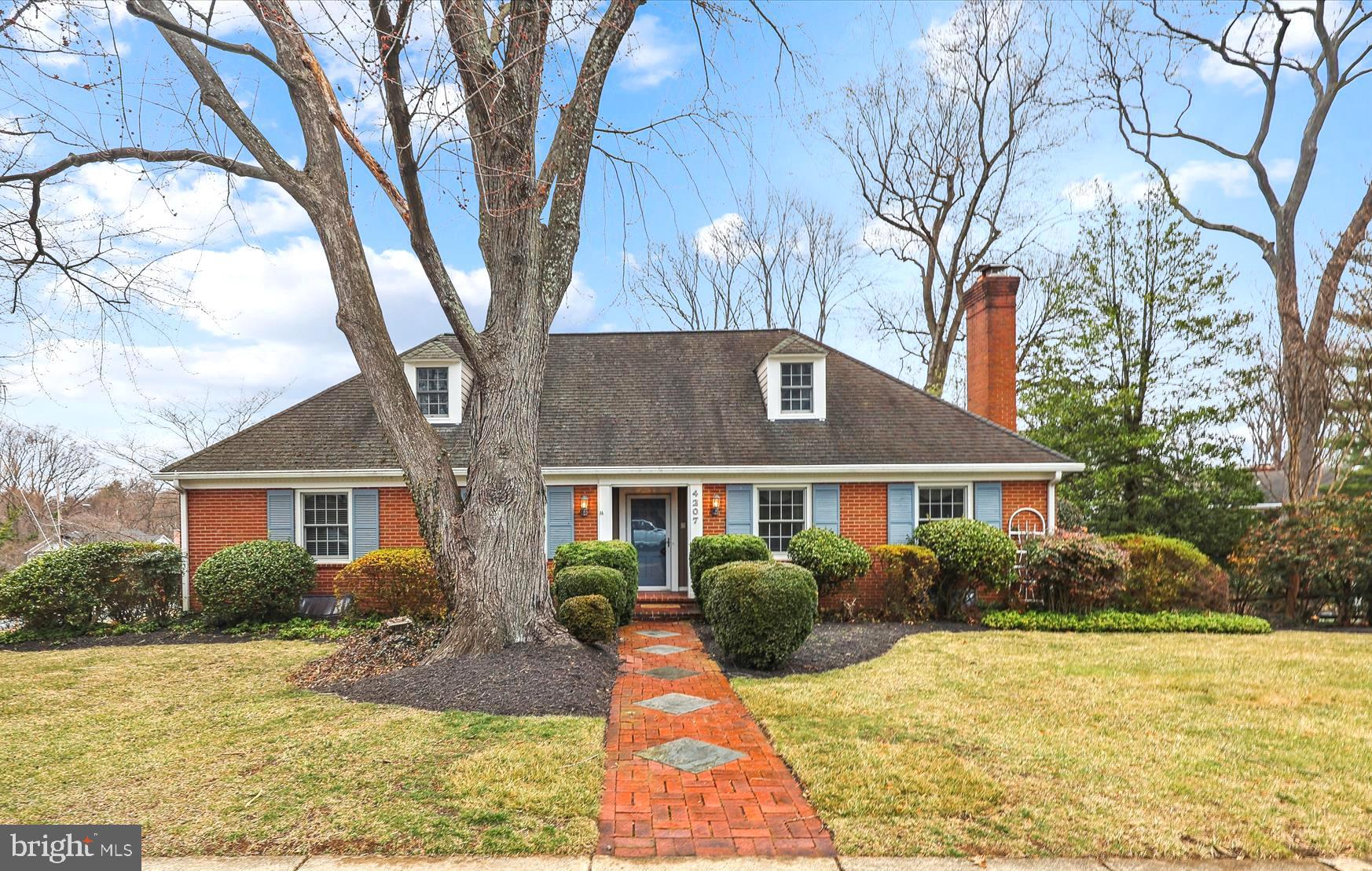 Stately expanded brick cape in Golf Club Manor.  Main level with beautiful hardwood floors, formal dining room with doors leading to a serene screen porch for hot summer days, lovely kitchen, 3  bedrooms and 2 full bath.  Expansive addition creates top level sanctuary with primary bedroom boasting so much natural light, spacious walk-in closet and gorgeous bathroom with exceptional vanity, loads of cabinetry, spa tub and walk in shower. Additional laundry and storage spaces round out the 3rd level
Charming lower level with stunning walnut floors, cozy den, magnificent  Rec room with fireplace and built ins, laundry, half bath and access to oversized 2 car garage. The flagstone patio is complete with pergola drenched in climbing hydrangea.  Rainwater irrigation system added to keep your plants healthy throughout the year!
Located in a quiet neighborhood yet minutes to parks, trails, nature center, shopping, restaurants and DC!