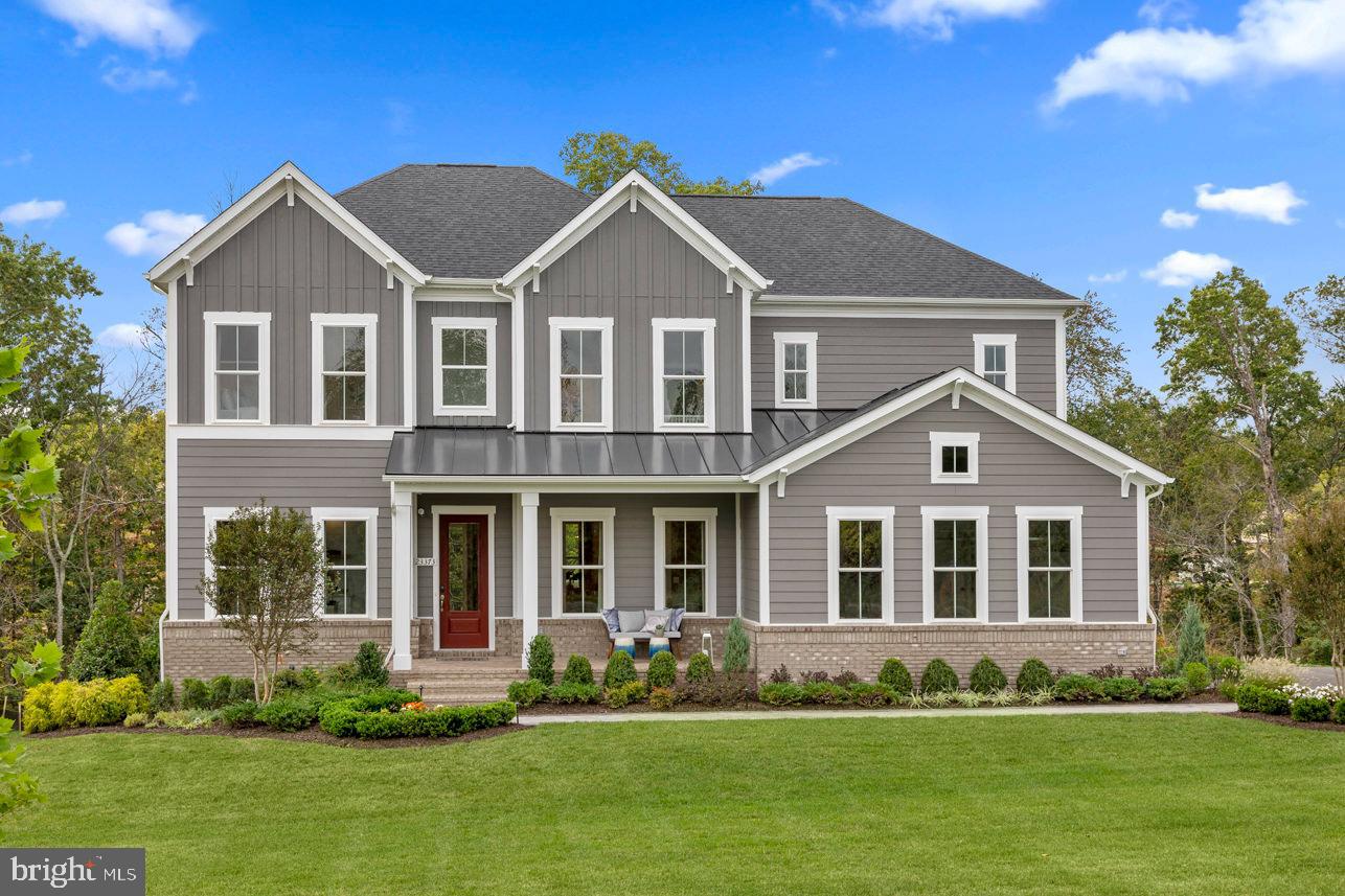 MODEL HOME INVESTMENT OPPORTUNITY! Builder will lease back from buyer. Gorgeous, spacious, airy model home with 10' ceilings, 3 finished levels, and covered porch featuring gas fireplace situated on a half-acre homesite in desirable Hartland community. The main level is an entertainer's dream with an enormous kitchen island overlooking a beautiful family room with an accordion door which leads to a stunning covered porch with a stone fireplace. Upstairs features 4 bedrooms and 4 full baths. The owner's suite has a cozy sitting room and a spa-like bath with a freestanding tub and oversized shower. The lower level has a bedroom and bath, media/multi-purpose room, and a huge rec room with incredible wet bar.