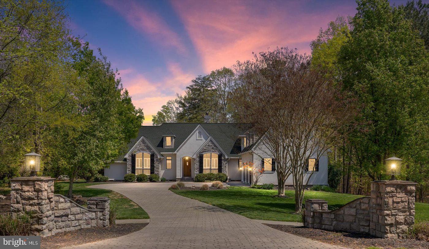 Distinctive French Country Estate in the Prestigious Fawn Lake Community!

Welcome to a truly one-of-a-kind French Country-style residence nestled on a beautifully landscaped 1.04-acre lot in the highly sought-after, gated community of Fawn Lake. Boasting 3,652 sq ft of thoughtfully designed living space, this elegant 4-bedroom, 2-full bath and 2-half bath home blends timeless architecture with modern comforts and high-end upgrades throughout.

Step through the custom front entry door—with its charming speakeasy window—and into a home filled with character. Soaring cathedral and vaulted ceilings, architectural columns, and custom grid-less windows invite natural light into every corner, creating a warm and inviting atmosphere.

The main-level primary suite offers a serene retreat, complete with a recently remodeled spa-inspired bathroom featuring a luxurious soaking tub, walk-in shower, and a spacious walk-in closet.

At the heart of the home lies a gourmet kitchen designed for both style and function. Outfitted with quartz countertops, a designer tile backsplash, stainless steel appliances, and an open-concept layout, this kitchen is perfect for casual meals and entertaining alike.

Additional features and highlights include:
- Freshly refurbished and painted main shutters for enhanced curb appeal
- Professionally landscaped grounds
- Expansive vinyl deck overlooking the backyard, ideal for outdoor living
- Spacious laundry room with sink and laundry chute
- Bonus 4th bedroom or recreation room above the garage
- Oversized 3-car garage (828 sq ft) with a temperature-controlled bay
- Walk-in attic offering generous storage space
- Double-sided see-through fireplace
- Large walk-in pantry with space for a coffee bar and extra mini fridge
- Main HVAC replaced in 2021, with the upstairs system upgraded in 2015 for year-round energy-efficient comfort.

Community Perks:
Enjoy resort-style living with access to Fawn Lake’s unparalleled amenities: a 288-acre recreational lake, private beach, golf course, clubhouse, marina, dining, tennis courts, sports fields, dog park, fitness center, scenic walking trails, playgrounds, and more.

✨ This is a rare opportunity to own a unique estate in one of the region’s most desirable communities. Schedule your private showing today and experience the lifestyle that awaits in Fawn Lake!