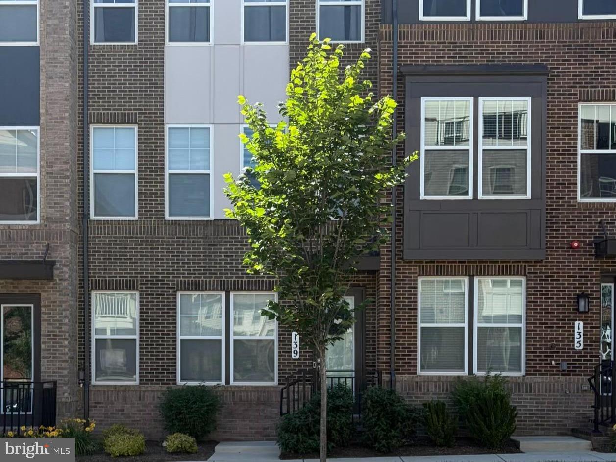 Like new and only four years young, this stunning four-level townhome offers exceptional flexibility, modern finishes, and multiple indoor and outdoor living spaces.

Upon entry, you'll find a spacious open room accompanied by a full bath, creating the perfect opportunity for a guest suite, fourth bedroom, home office, fitness room, or additional living space.

The main level is designed for both everyday living and entertaining, featuring a beautiful center kitchen that serves as the heart of the home. Designated living and dining spaces flow seamlessly around the kitchen, while a large deck just off the kitchen extends your living space outdoors, perfect for grilling, dining ,or simply relaxing. A convenient half bath is also located on this level.

The third floor offers three bedrooms, including a spacious primary suite with a beautiful ensuite bath and generous closet space.

Continue to the top level where you'll discover another grand open space with endless possibilities. Whether used as a family room, media room, home office, or guest retreat, this versatile area opens directly to a fabulous rooftop terrace, providing the perfect setting for entertaining or enjoying the outdoors. An additional half bath on this level adds convenience.

Only four years old, this thoughtfully designed home combines modern style, flexible living areas, and exceptional outdoor spaces to create a truly special offering.

Located in vibrant Downtown Crown, you'll enjoy a truly walkable lifestyle with restaurants, shops, fitness studios, grocery stores, parks, community events, and entertainment just steps from your front door. Combining modern design, flexible living spaces, and an unbeatable location, this exceptional home offers the very best of Crown living.