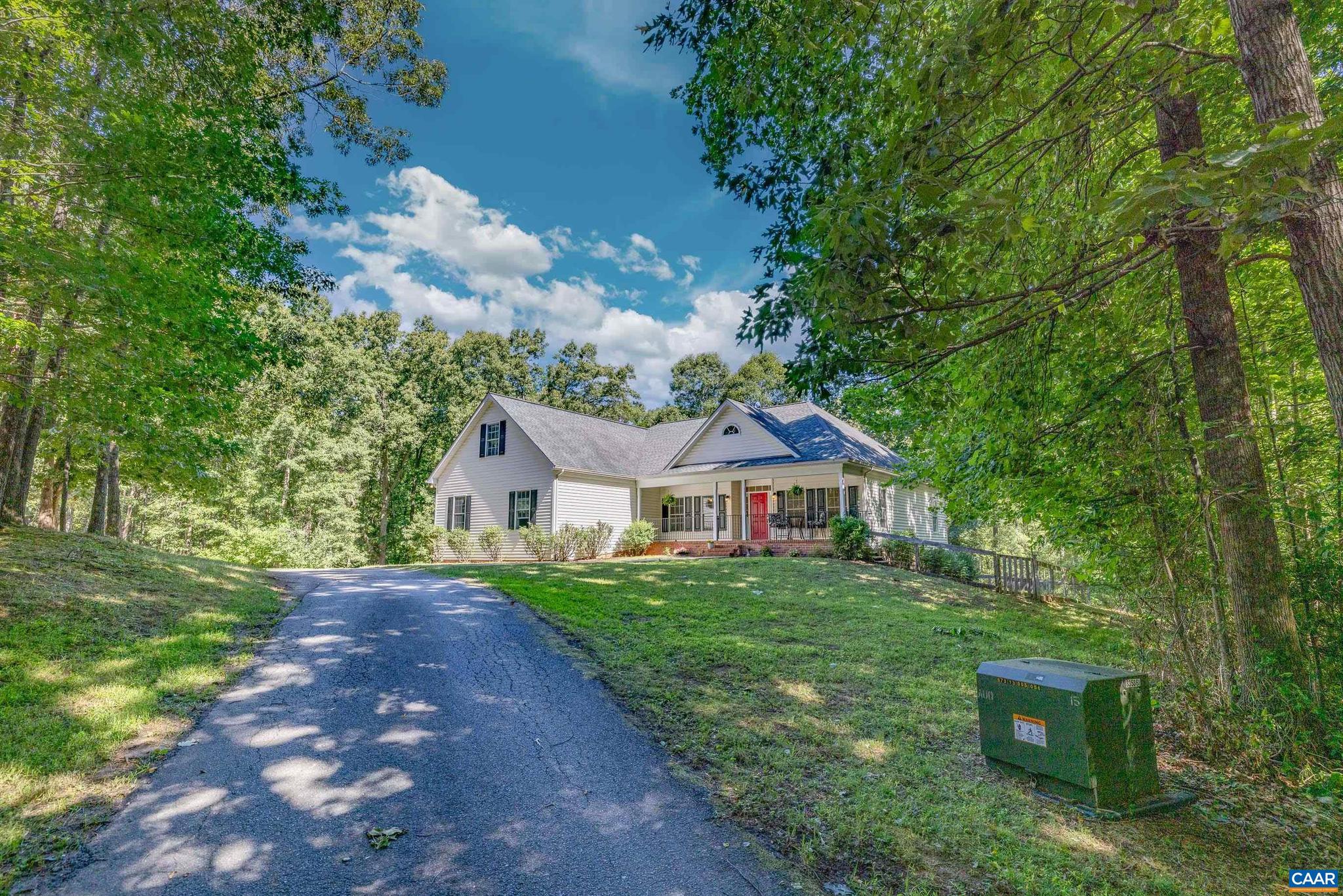Nestled on over eight acres in Northern Albemarle County, 3002 Burnley Station Rd offers the perfect blend of rural charm, peace and convenience. This beautiful property is thoughtfully set up for horses, goats, donkeys.. you name it- making it an ideal retreat for homesteaders or hobby farmers. The main level includes a private primary suite, with two large closets, a soaking tub, and heated bathroom floors, with the laundry room and loft bonus room just steps away. Across from the living room and kitchen, there are two additional spacious bedrooms and a full bathroom. Upstairs, you'll find a generous-sized bonus room that can be used as a guest suite (with full bath), playroom, or office space! Downstairs, there is plenty of storage space, as well as a finished apartment with two bedrooms, a full kitchen and a large bathroom/second laundry room. This home is a blank canvas! Completely private, surrounded by mature trees, yet still just a few minutes from the conveniences of 29N and Charlottesville- this home welcomes you with hardwood floors, plenty of natural light and extremely spacious rooms. Experience the best of country living at 3002 Burnley Station Rd, where comfort, space and natural beauty come together.,Fireplace in Living Room