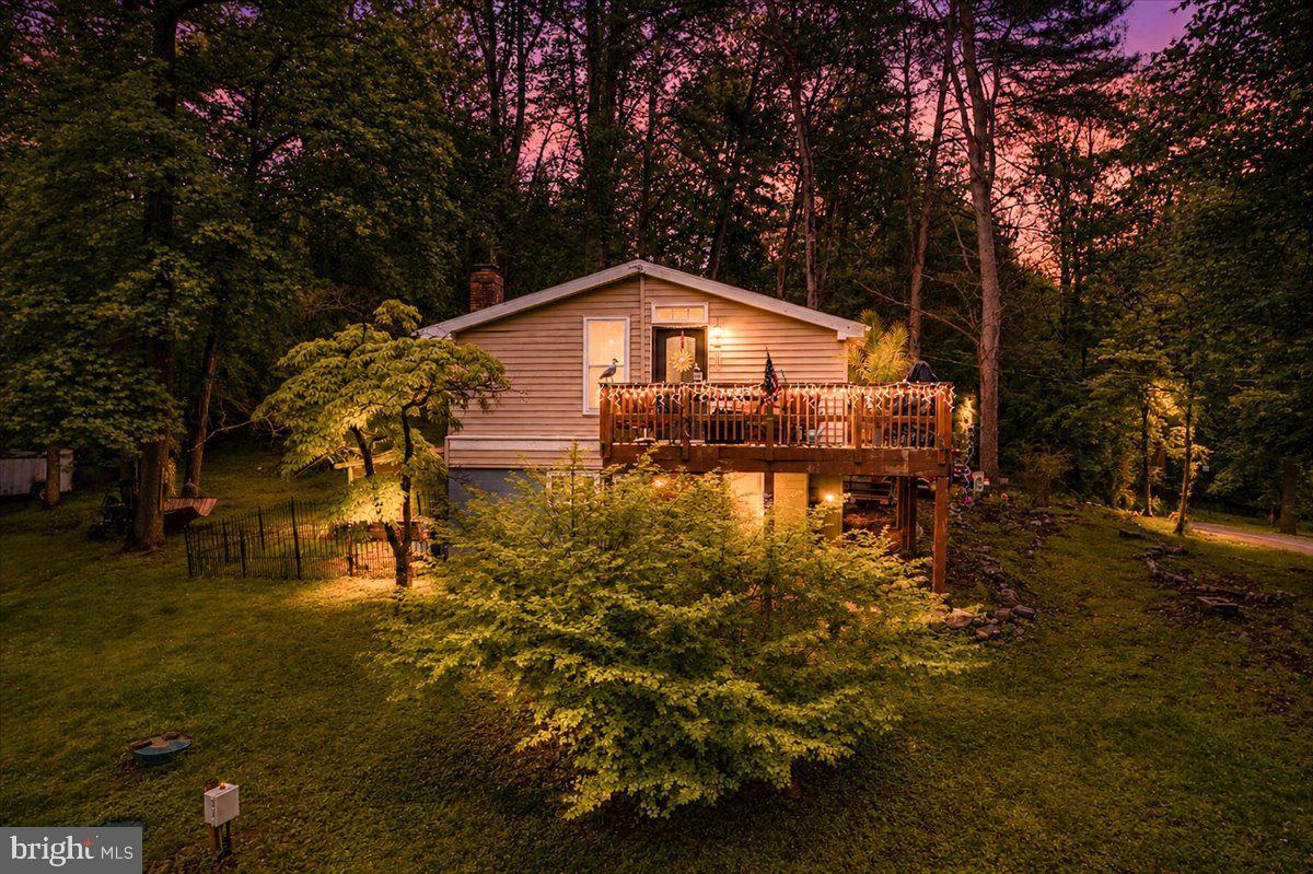 Fantastic value oriented cabin blocks from the Shenandoah River in Shannondale, Jefferson County's gateway to Virginia.  This wonderful little property may have trouble chugging along with many financing programs due to the layout of the bedrooms and upper level layout.  It may require cash or conventional financing only, but the owner is aware and is pricing it accordingly and is flexible on numbers.  Don't get me wrong, this place needs some work, but at over 1000 sq ft total, the costs to renovate will not be much relatively.  This could be a great weekenders retreat or air b and b once work is done!
