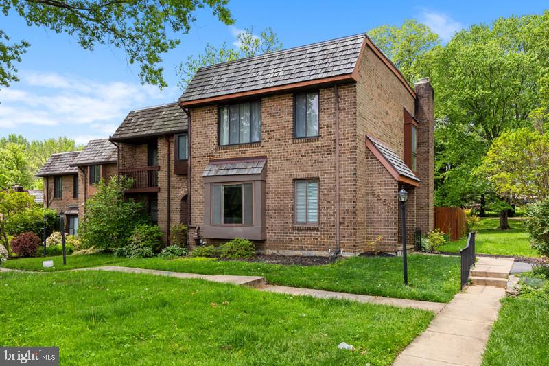 This exceptional brick end-unit offers both space and elegance, set back from the street with a private side entrance. Situated on a premium lot backing to Open Space, it provides a peaceful, park-like retreat—best enjoyed from the expansive, fenced-in stone patio. Inside, beautiful parquet floors grace the dining and living areas, complemented by updated tiled baths for a touch of modern sophistication. The stylish eat-in kitchen boasts sleek granite countertops and a charming box bay window, filling the space with natural light. The lower level is equally impressive, featuring a versatile workshop and laundry area, a bonus room perfect as a potential fourth bedroom, and a beautifully finished recreation room with luxury vinyl plank flooring. Ideally located in Columbia, this home is just minutes from Town Center, the scenic Lakefront, the Library, and the dynamic Merriweather district, where an array of dining options awaits.  Walking and biking trails further enhance this exceptional Columbia location in addition to providing effortless access to major highways, ensuring convenience and connectivity.