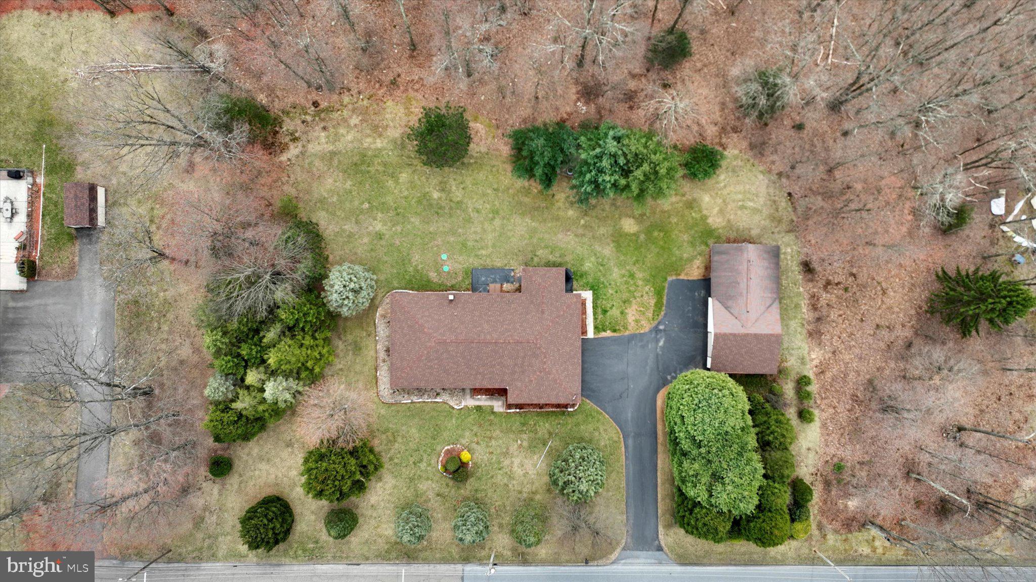 This RARE find envelops pride in ownership! Situated on a peaceful 2.28 acres, this Ranch home has it all! *Highest and Best deadline  8pm Thursday 4/17 * The home features 4 spacious bedrooms and 2.5 baths. The newly added primary suite features a contemporary tray ceiling, double closets,  en suite custom tile bathroom with radiant heat and double bowl vanity. The 25 handle kitchen features solid wood cabinetry and appliances are included. Hardwood flooring throughout most of the home. Don't miss the full basement which can easily be finished for more living area and includes half bath and laundry. Plenty of parking with 2-car attached garage, 1-2 car detached garage, and large paved driveway.  The detached garage also features a separate heated man cave/she shed/entertaining area. Just picture the summer picnics and campfires or watching wildlife from your back porch. Ductless air conditioning/mini splits (2), electric baseboard heat, 200amp electric, public water, onsite septic, new pex plumbing, septic 2023. This is one you don't want to miss!